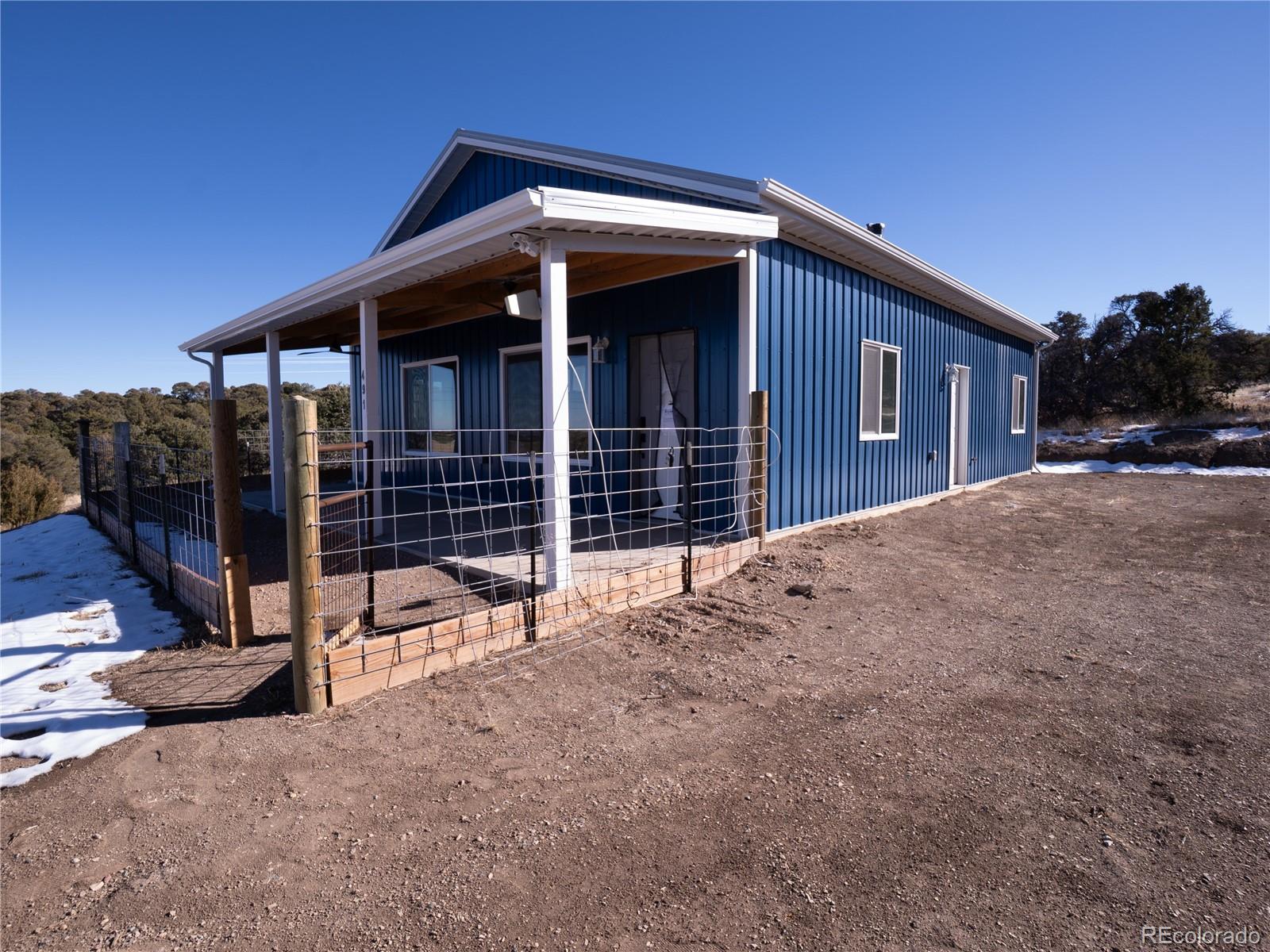 491 Ketchum Road Walsenburg, CO 81089 - Photo 4 of 20 a front view of a house with a yard