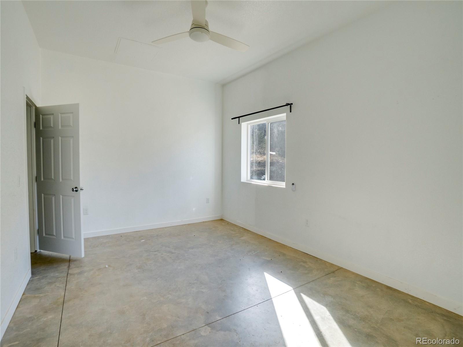 491 Ketchum Road Walsenburg, CO 81089 - Photo 7 of 20 an empty room with windows