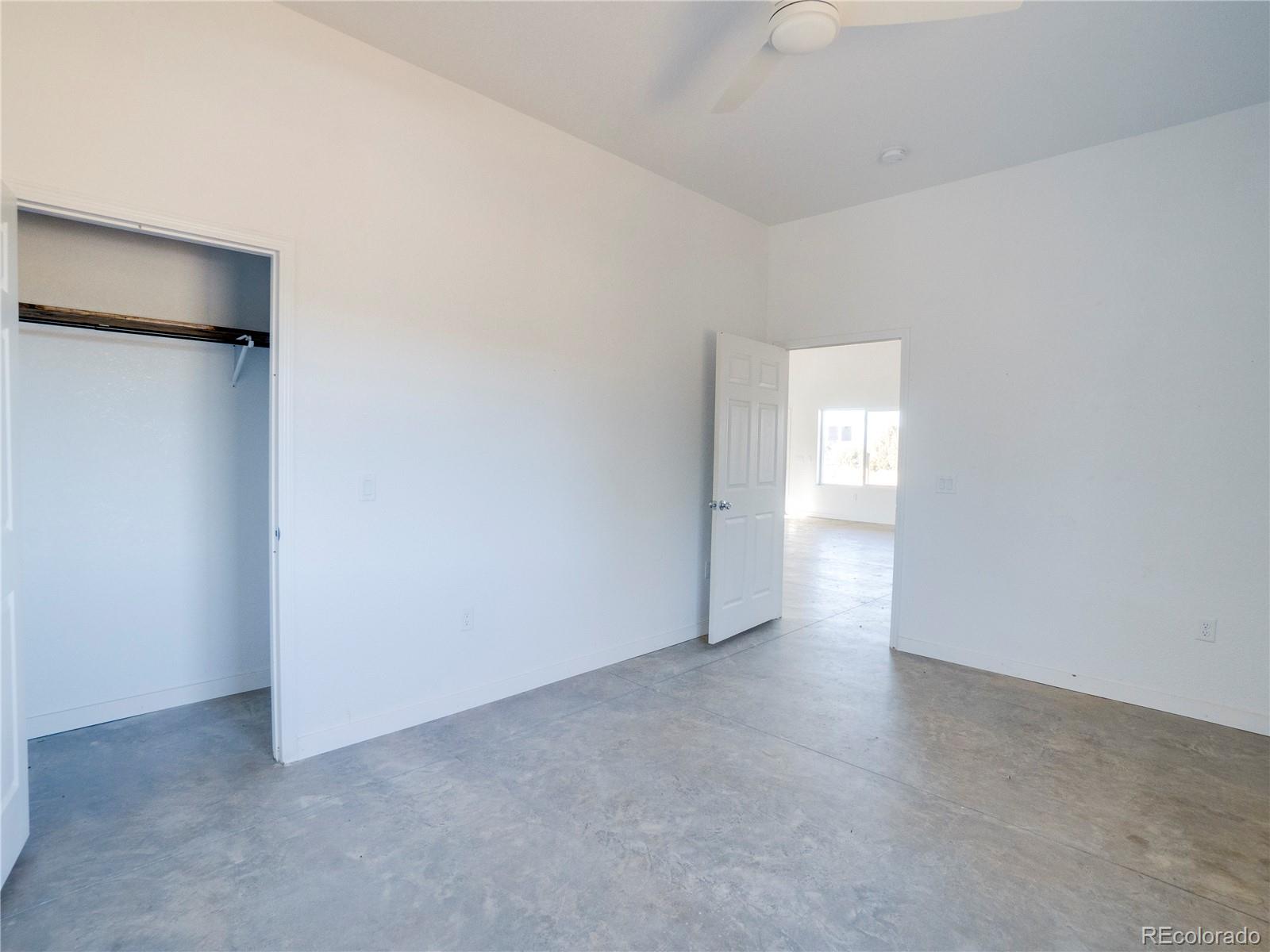 491 Ketchum Road Walsenburg, CO 81089 - Photo 9 of 20 a view of an empty room with a window