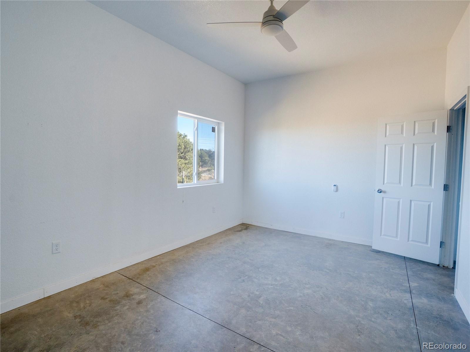 491 Ketchum Road Walsenburg, CO 81089 - Photo 10 of 20 an empty room with a window