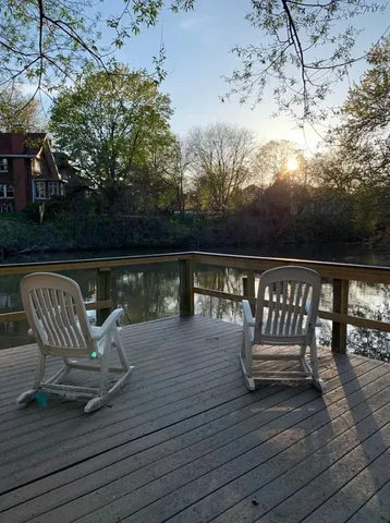 a view of a chairs and table on the wooden floor