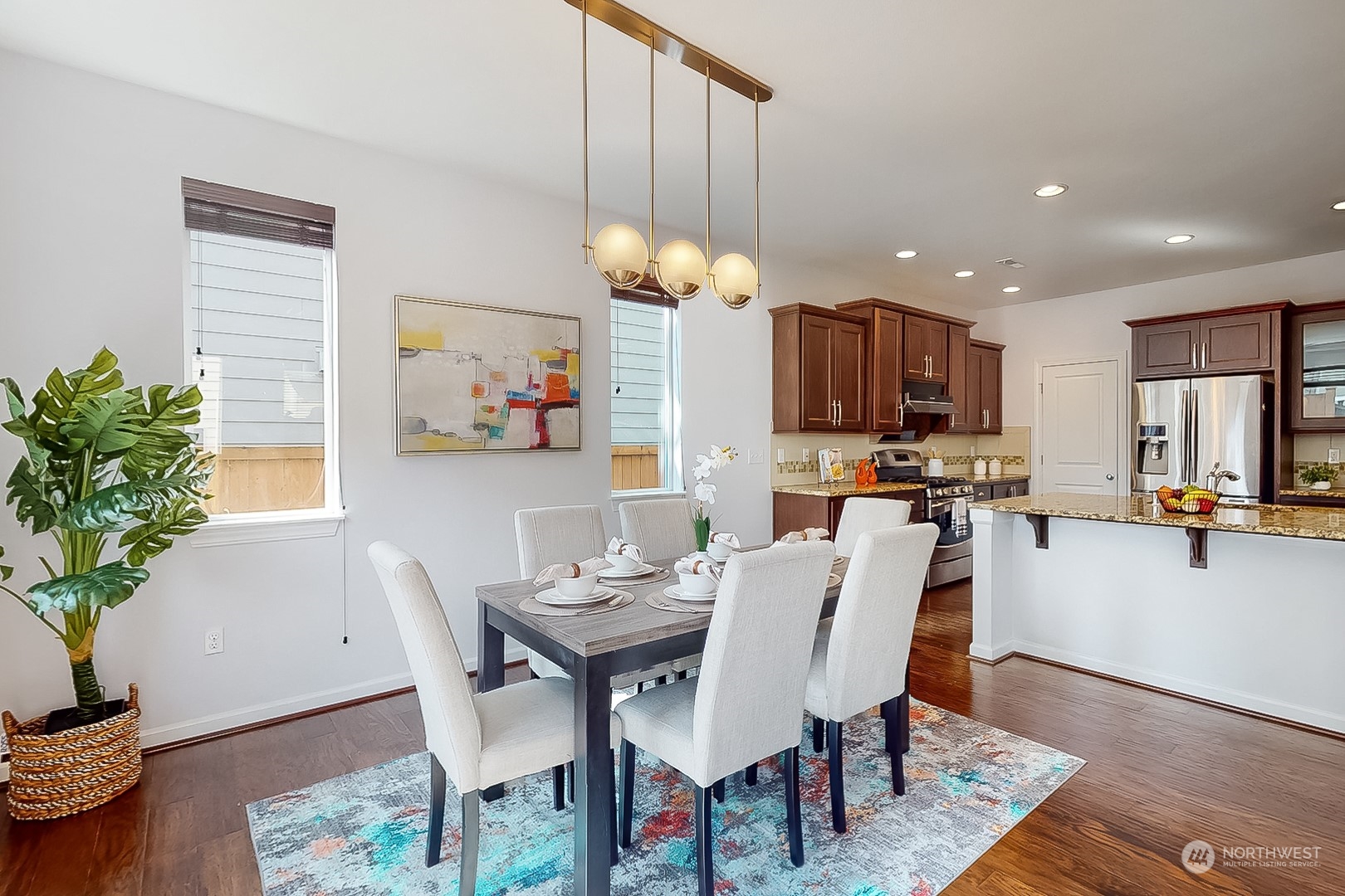 3602 195th Place Southeast Bothell, WA 98012 - Photo 11 of 28 a view of a dining room with furniture and wooden floor