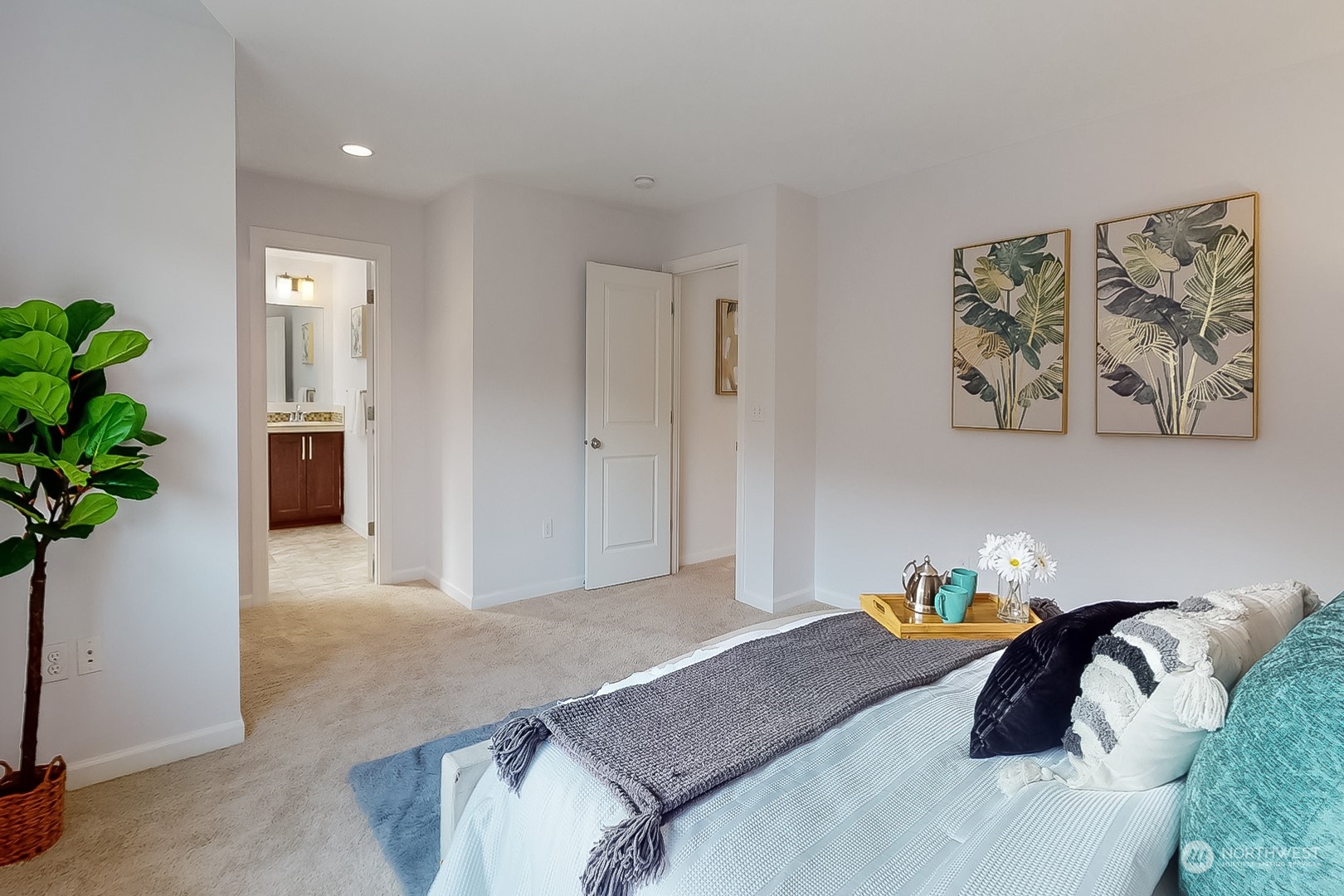 3602 195th Place Southeast Bothell, WA 98012 - Photo 15 of 28 a bedroom with a bed and a potted plant