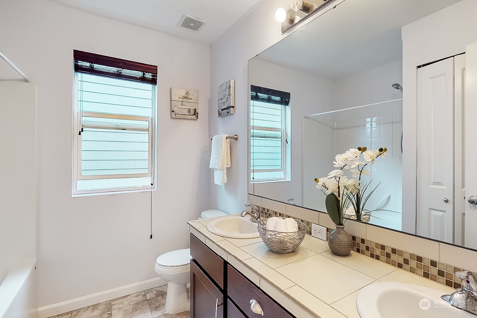 3602 195th Place Southeast Bothell, WA 98012 - Photo 21 of 28 a bathroom with a granite countertop sink toilet and mirror