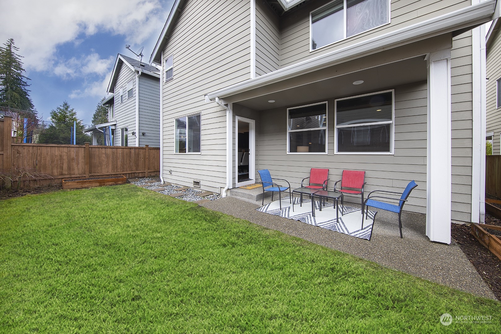 3602 195th Place Southeast Bothell, WA 98012 - Photo 24 of 28 a backyard of a house with table and chairs