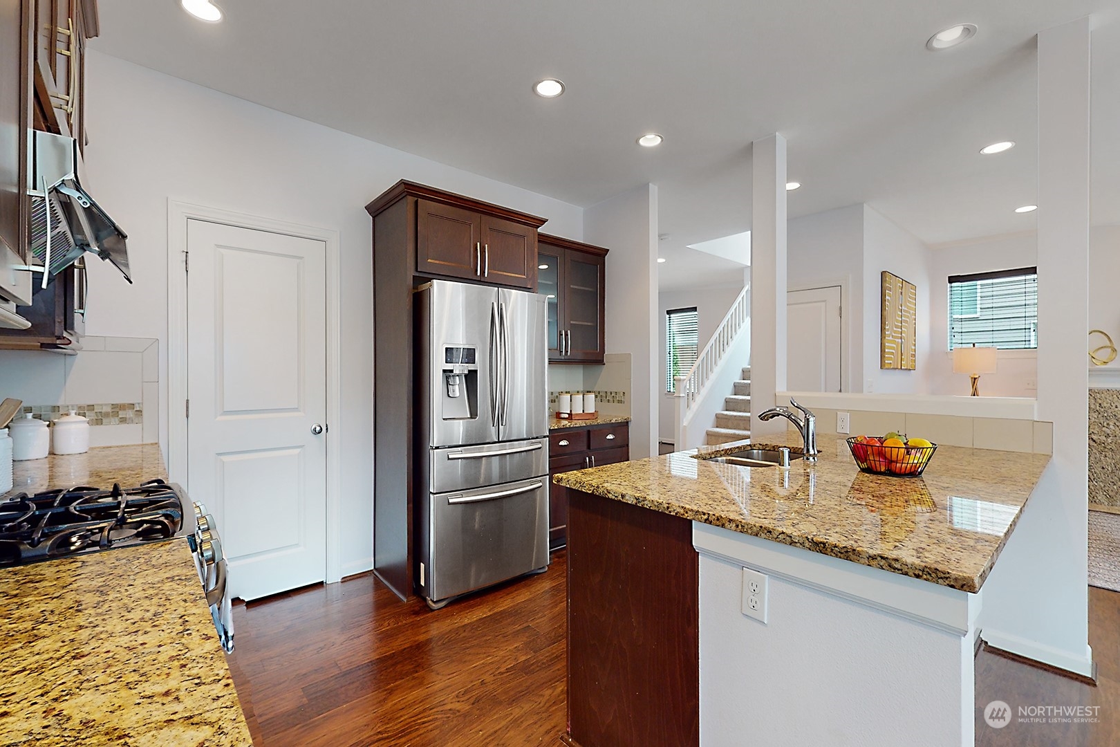 3602 195th Place Southeast Bothell, WA 98012 - Photo 9 of 28 a kitchen with sink refrigerator and stove