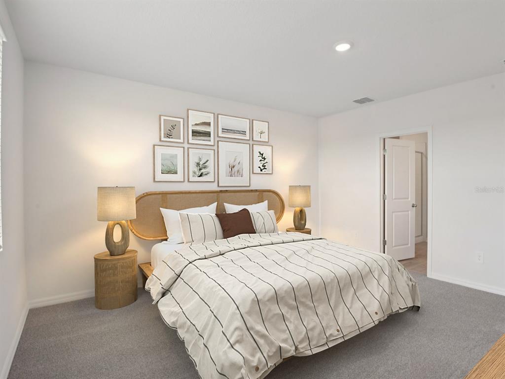 1655 Bark Rdg Drive Auburndale, FL 33823 - Photo 19 of 21 a bedroom with a bed and a night lamp
