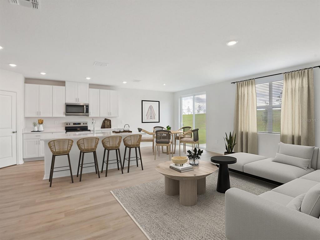 1655 Bark Rdg Drive Auburndale, FL 33823 - Photo 6 of 21 a living room with lots of furniture kitchen view and a window