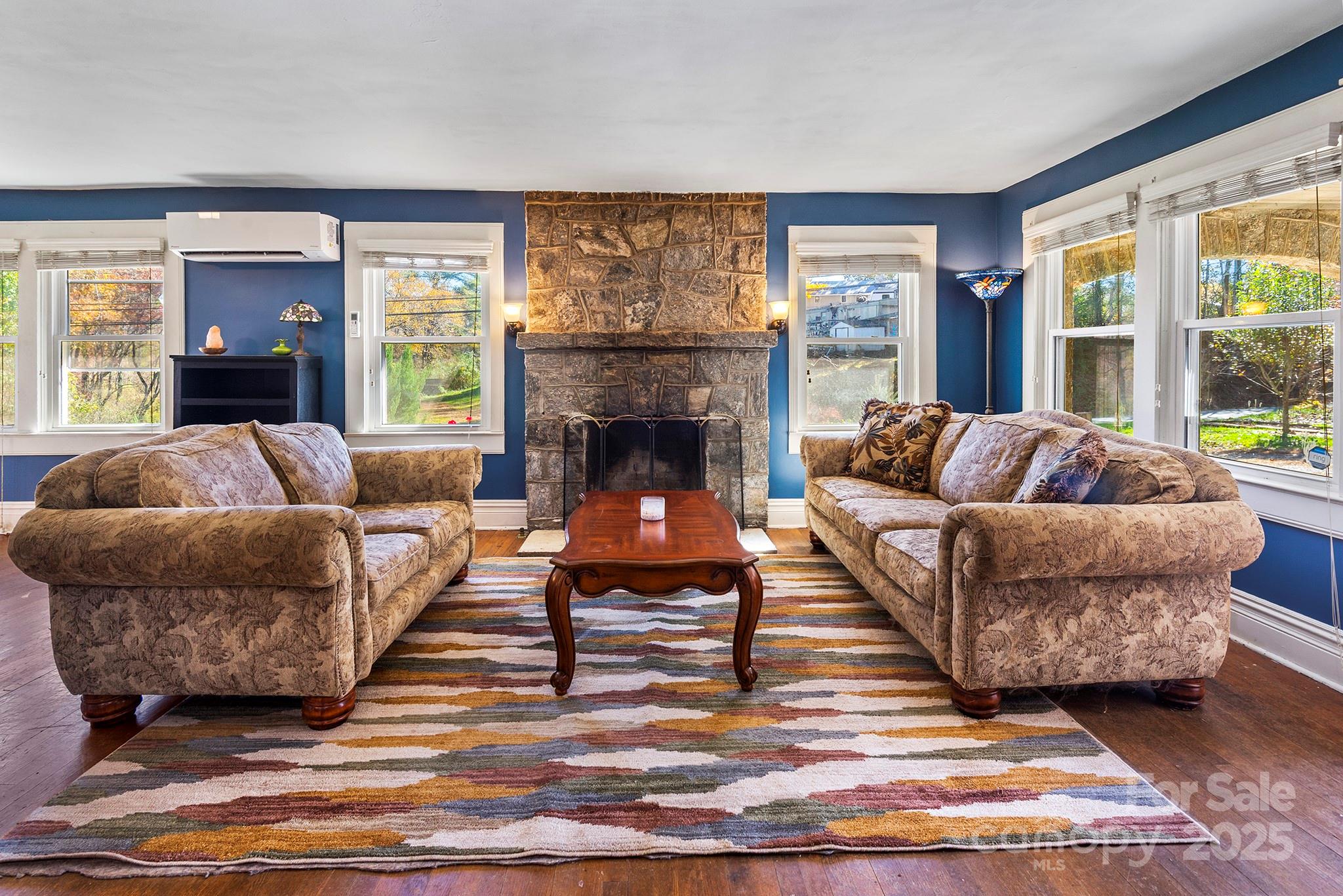 914 Catheys Creek Church Road Brevard, NC 28712 - Photo 14 of 33 a living room with furniture and a fireplace