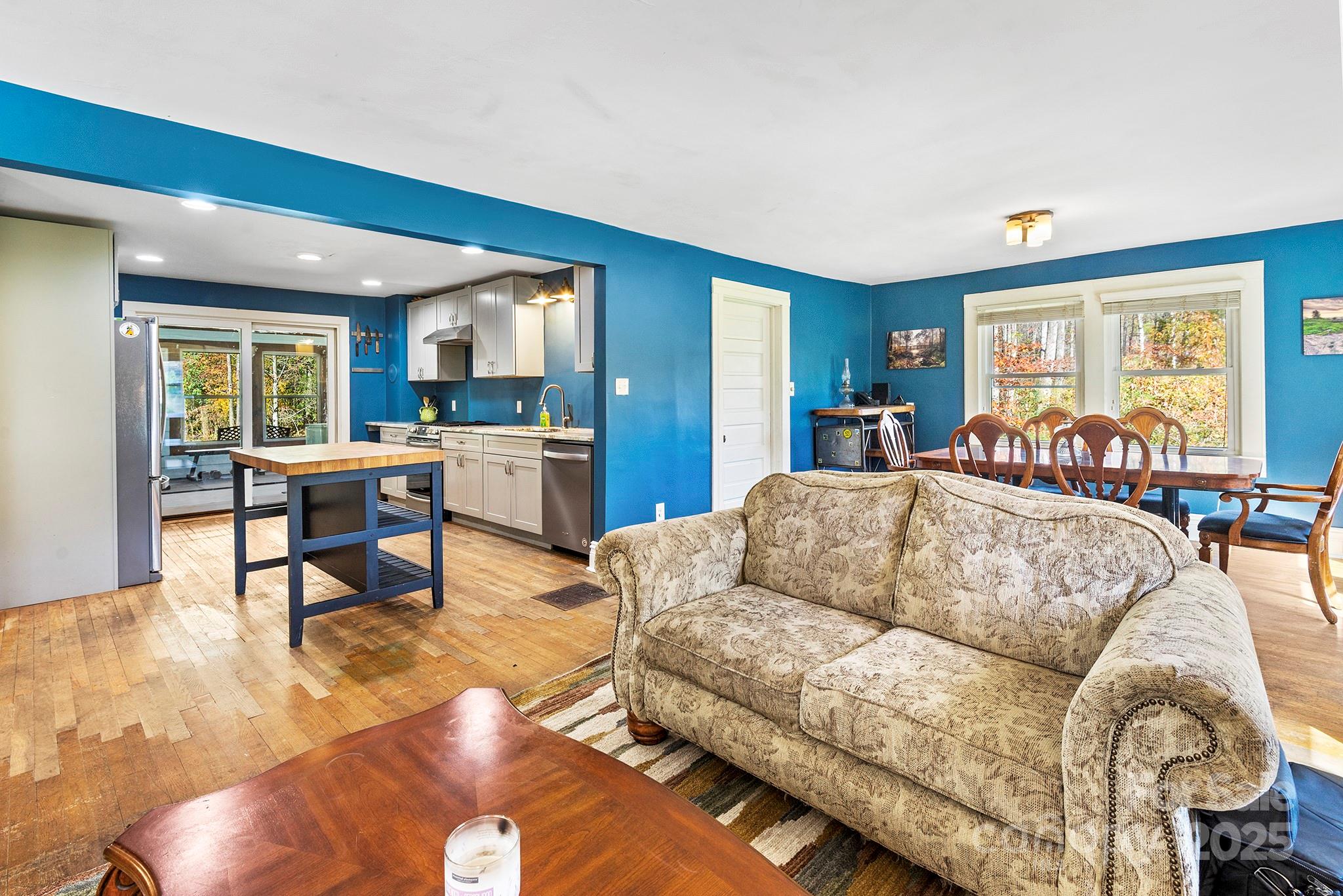 914 Catheys Creek Church Road Brevard, NC 28712 - Photo 15 of 33 a living room with furniture and a large window