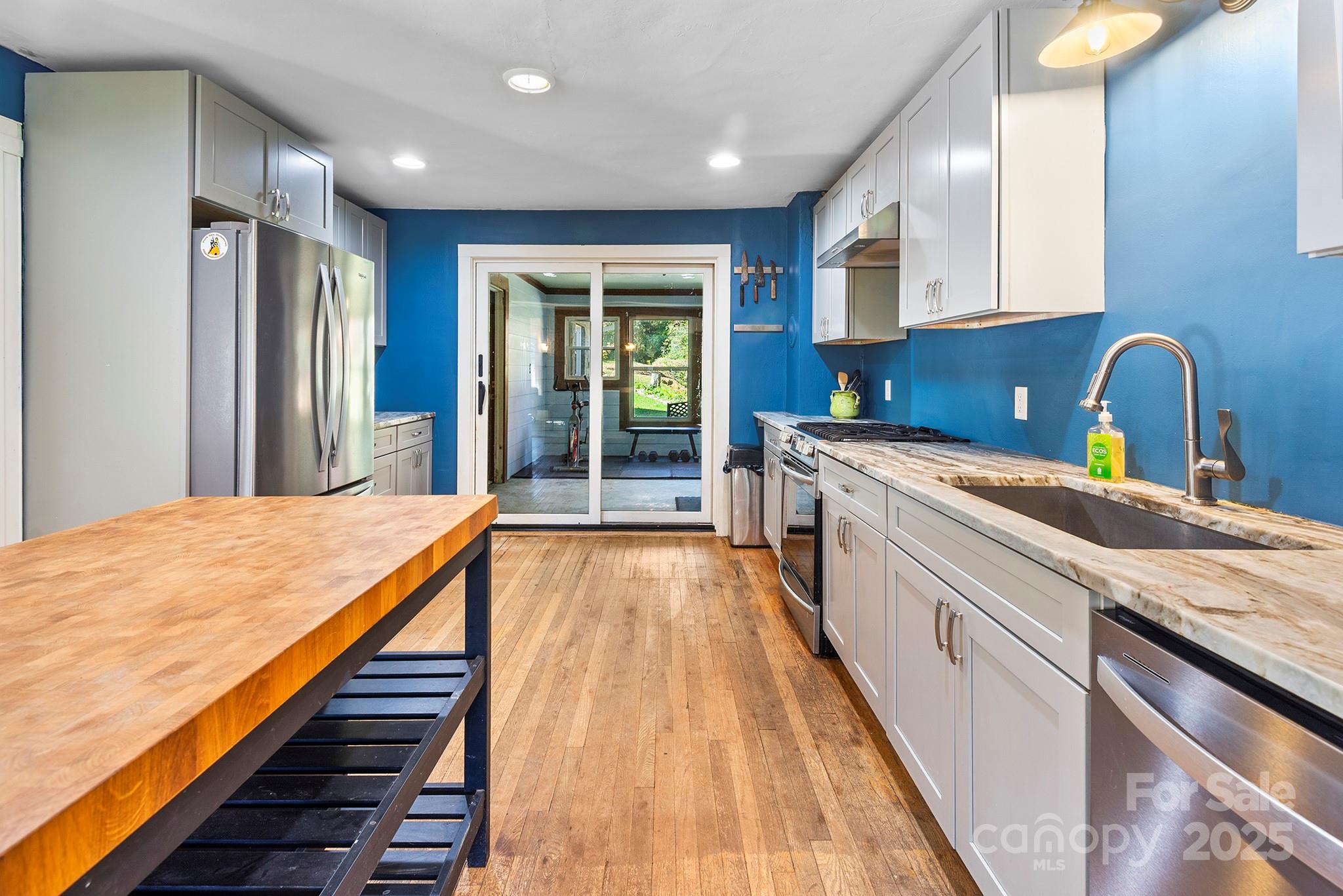 914 Catheys Creek Church Road Brevard, NC 28712 - Photo 17 of 33 a spacious bathroom with a granite countertop sink