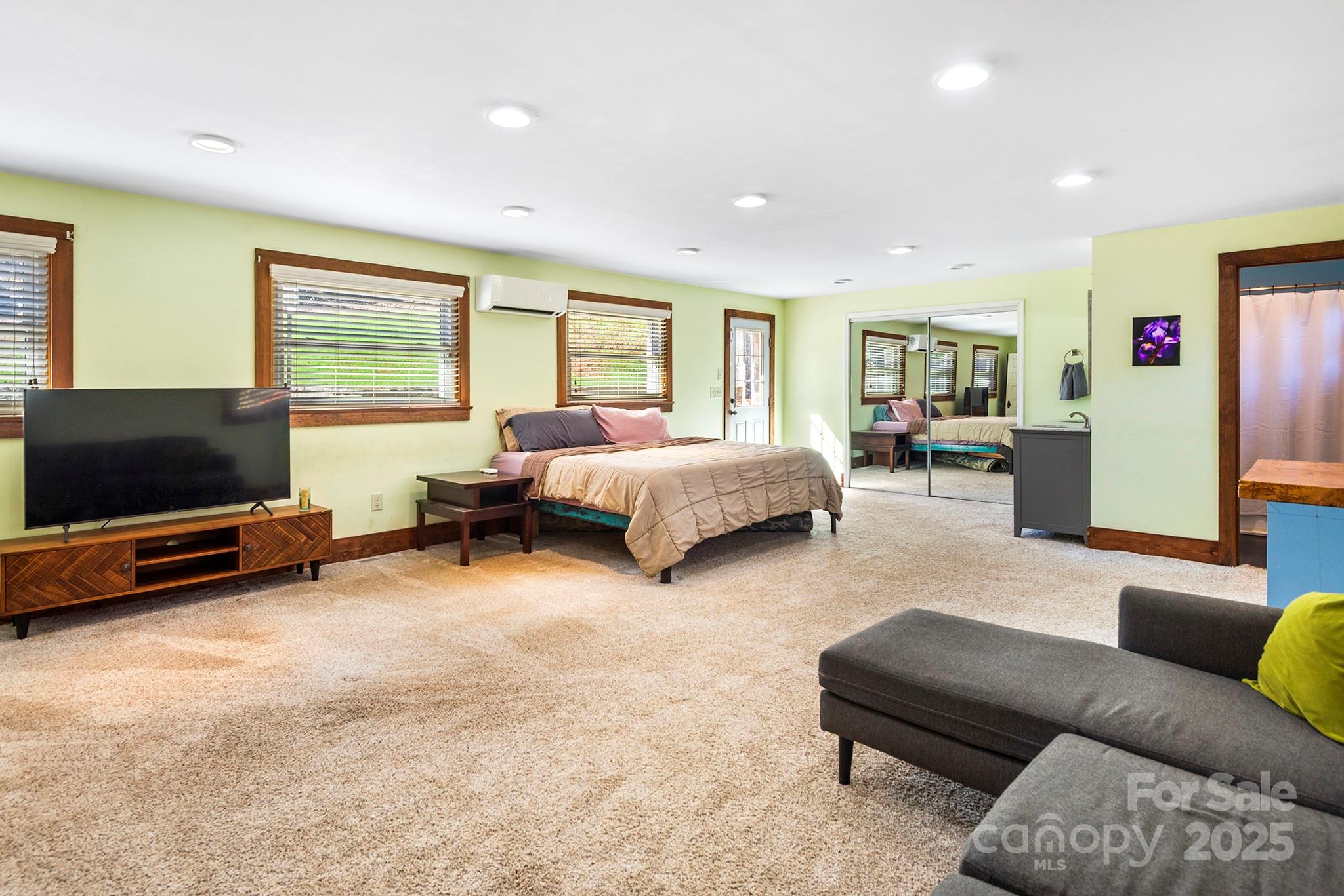 914 Catheys Creek Church Road Brevard, NC 28712 - Photo 21 of 33 a living room with furniture and a flat screen tv