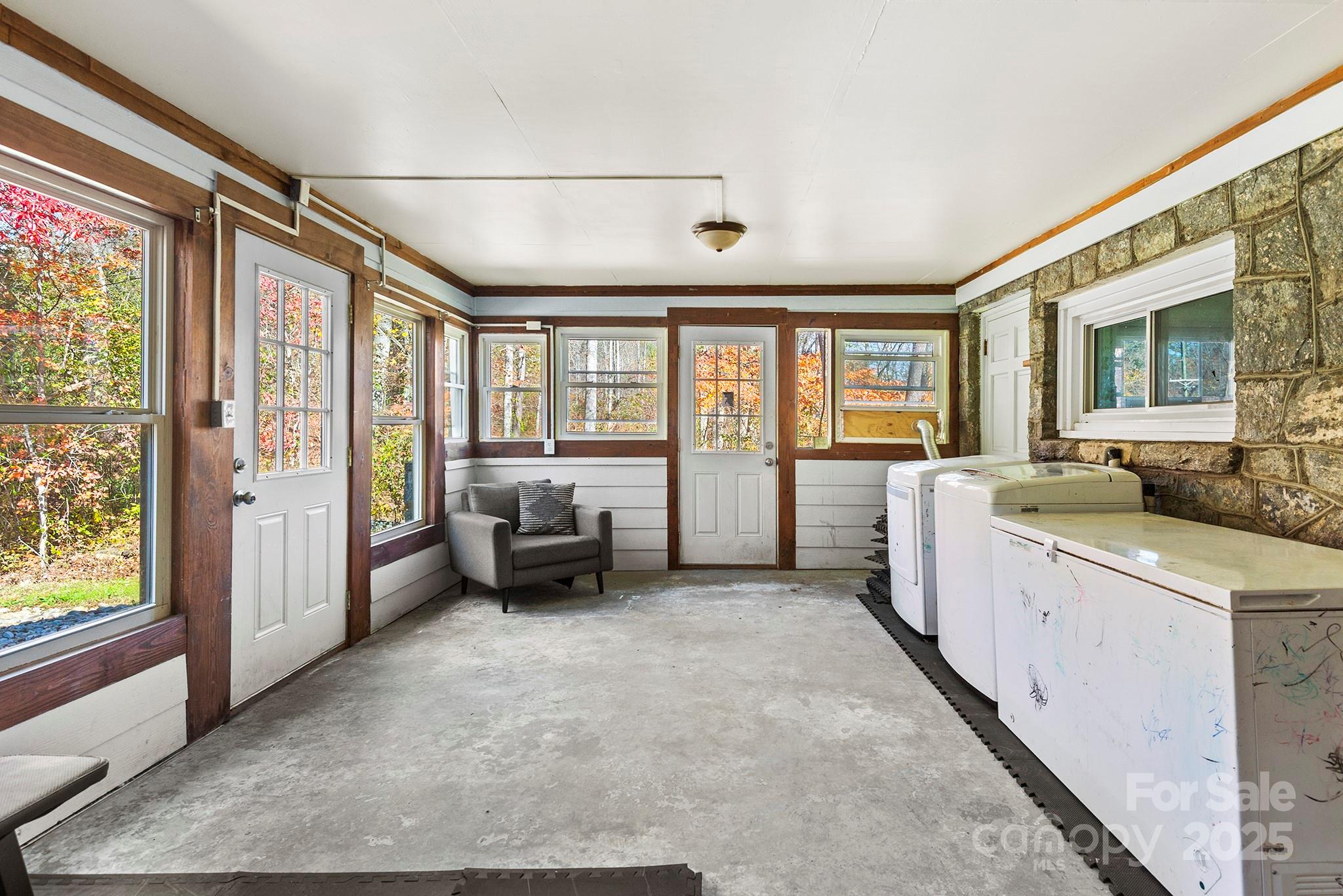 914 Catheys Creek Church Road Brevard, NC 28712 - Photo 27 of 33 a room with furniture and large windows