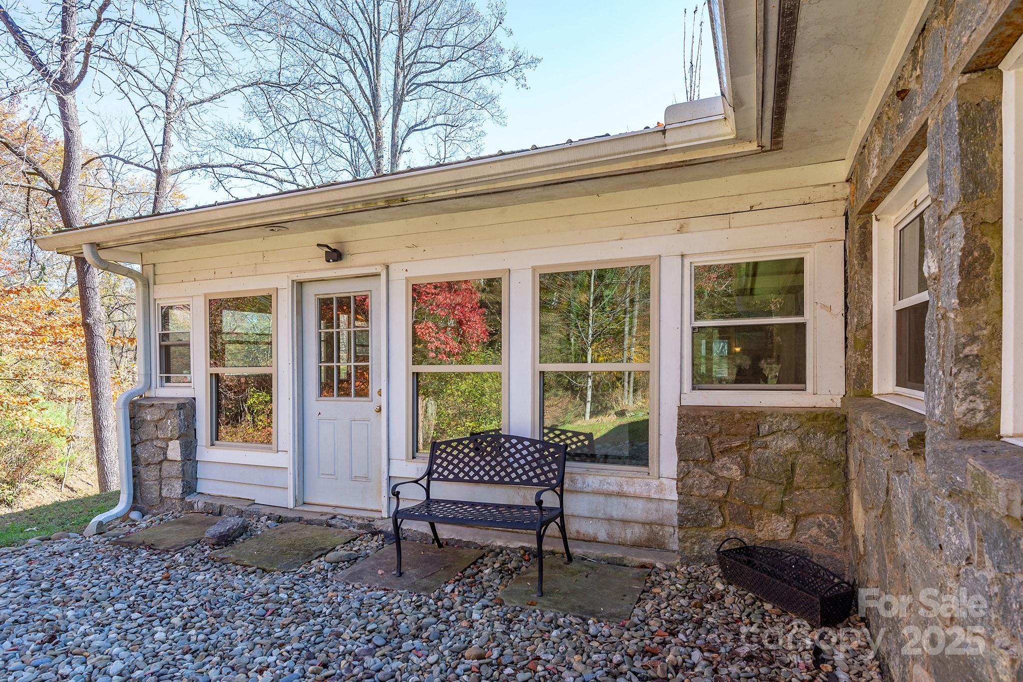 914 Catheys Creek Church Road Brevard, NC 28712 - Photo 29 of 33 a view of a patio with a chairs and table in a patio
