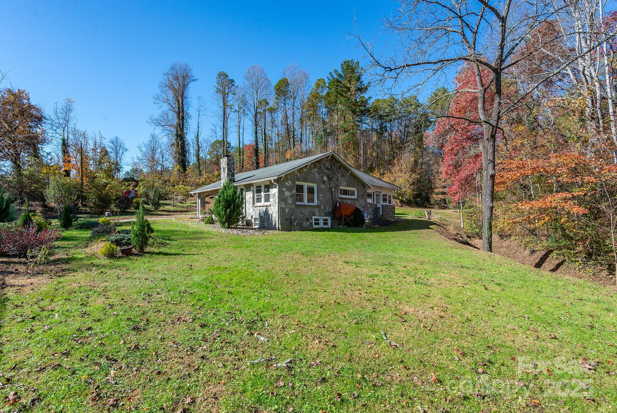 914 Catheys Creek Church Road Brevard, NC 28712 - Photo 31 of 33 a house view with a garden space