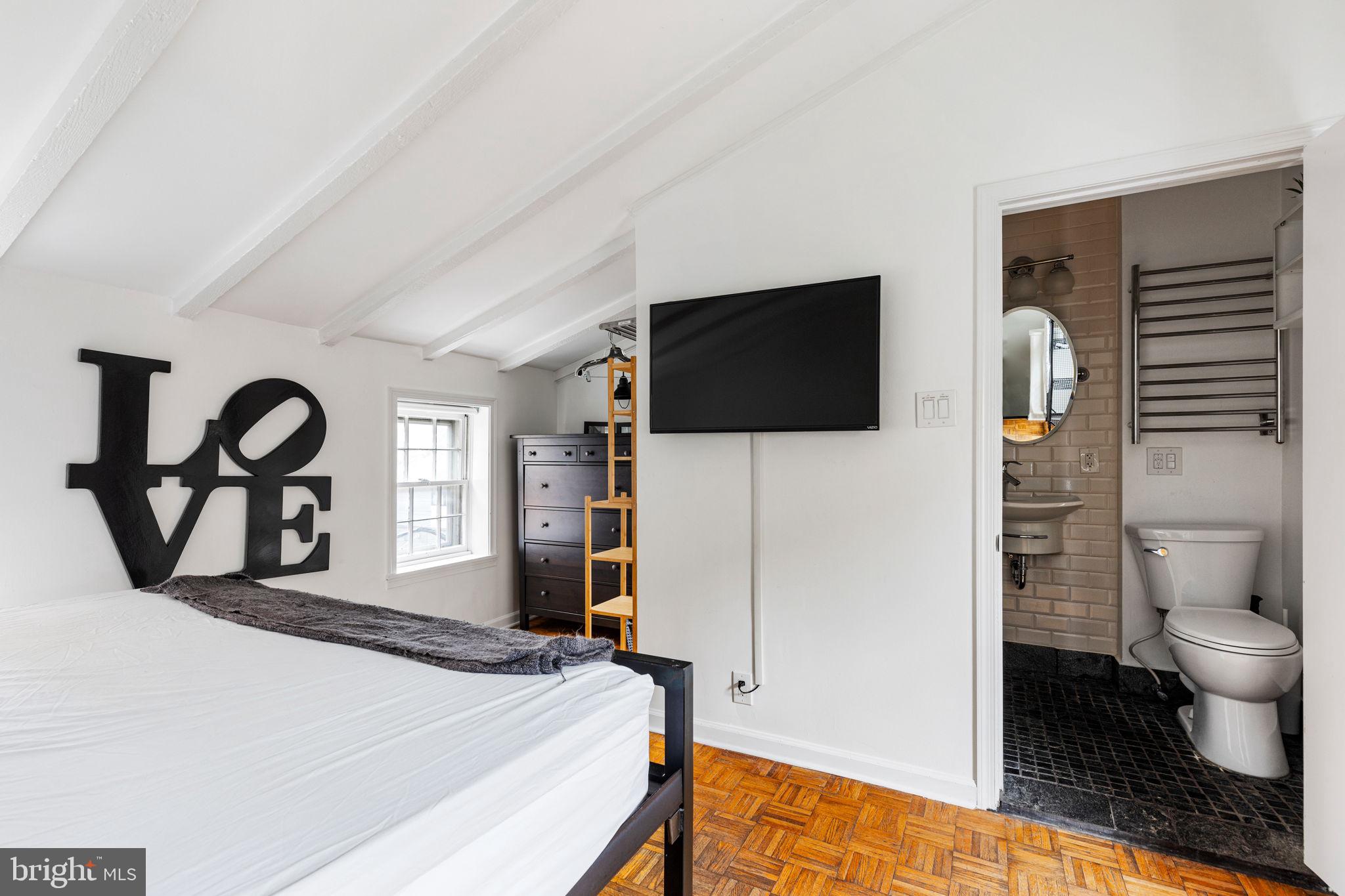 2127 Rodman Street Philadelphia, PA 19146 - Photo 12 of 19 a bedroom with a bed window and a flat screen tv