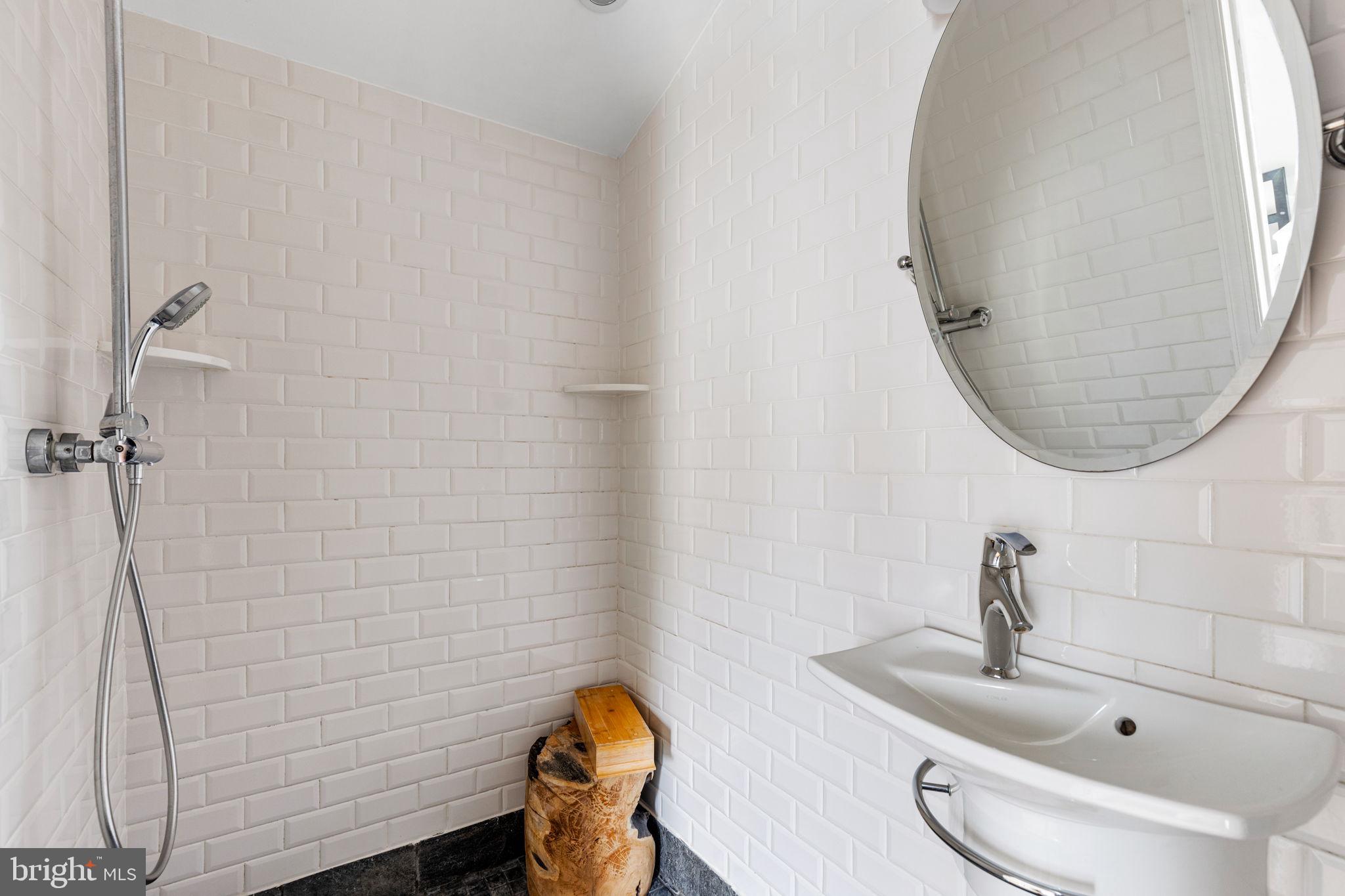 2127 Rodman Street Philadelphia, PA 19146 - Photo 14 of 19 a bathroom with a sink and a mirror