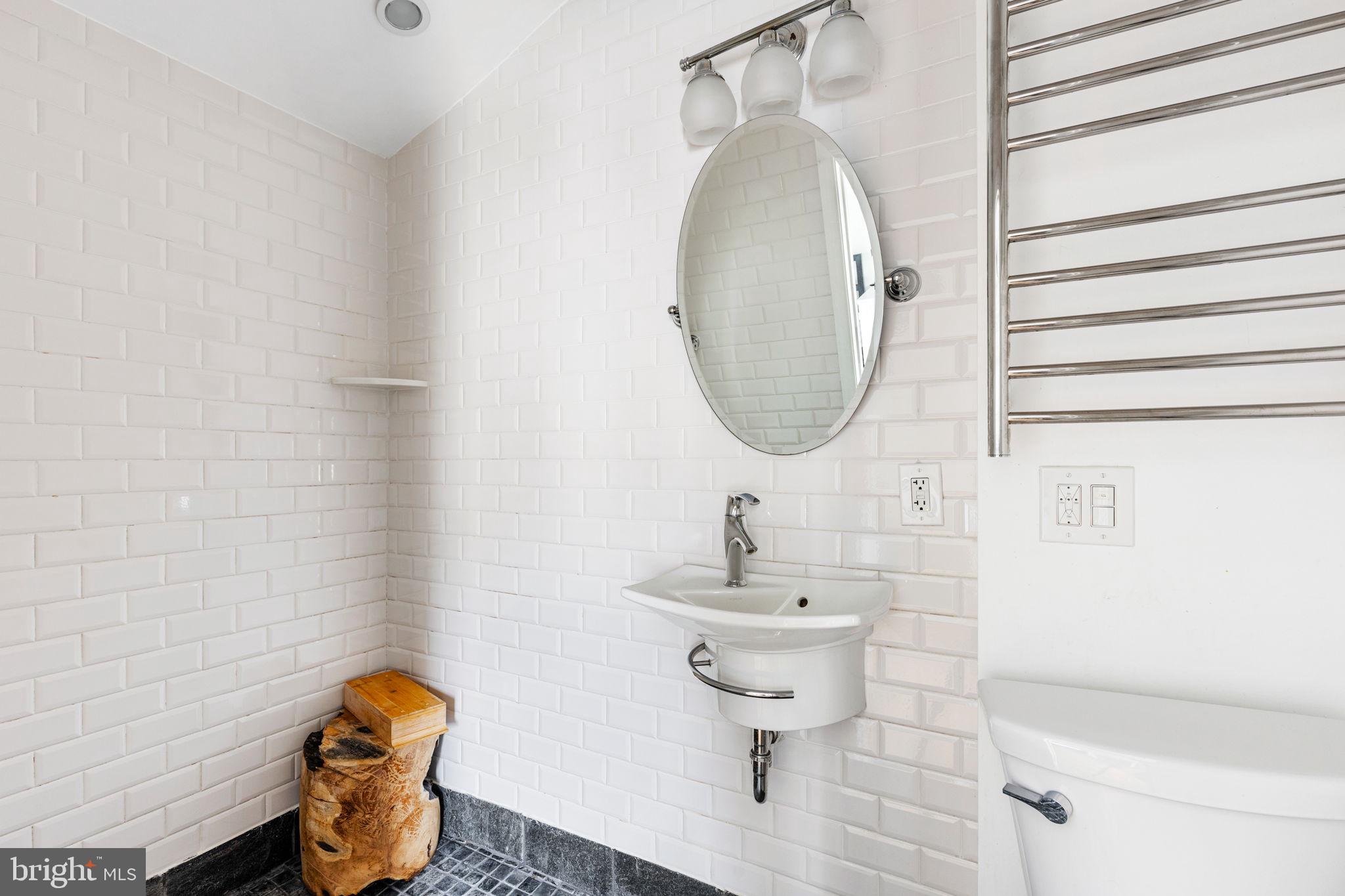 2127 Rodman Street Philadelphia, PA 19146 - Photo 15 of 19 a bathroom with a sink toilet and mirror