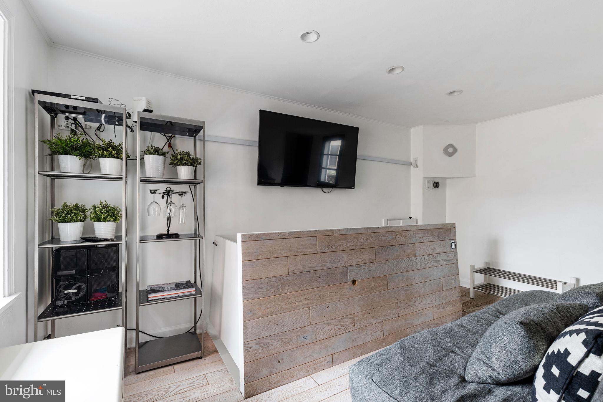 2127 Rodman Street Philadelphia, PA 19146 - Photo 4 of 19 a living room with furniture and a flat screen tv