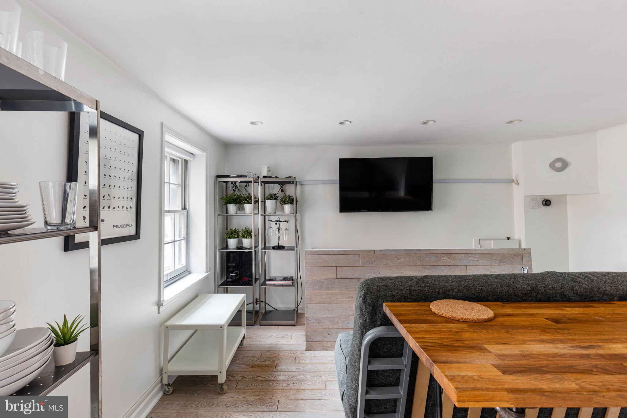 2127 Rodman Street Philadelphia, PA 19146 - Photo 5 of 19 a living room with furniture and a flat screen tv