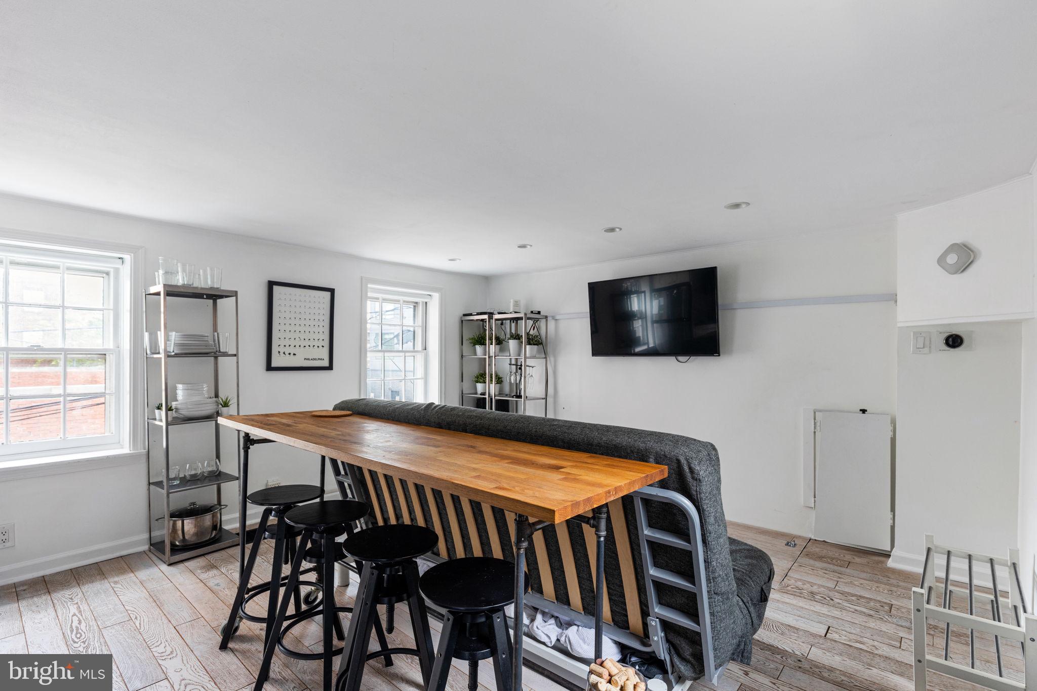 2127 Rodman Street Philadelphia, PA 19146 - Photo 7 of 19 a living room with furniture and flat screen tv