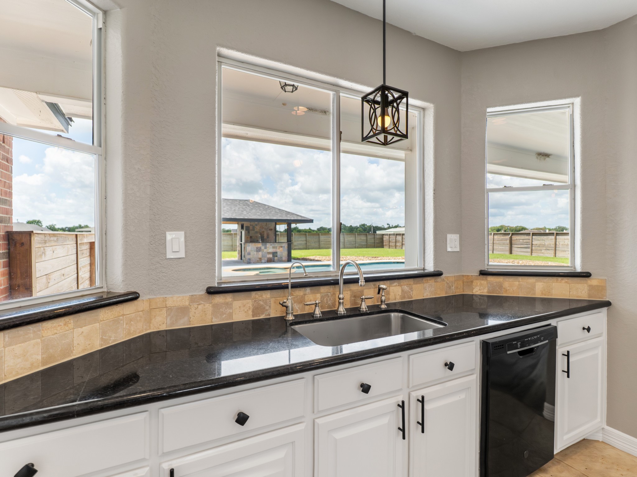 863 Bunkhouse Trail Angleton, TX 77515 - Photo 15 of 42 Even doing dishes comes with a pool view