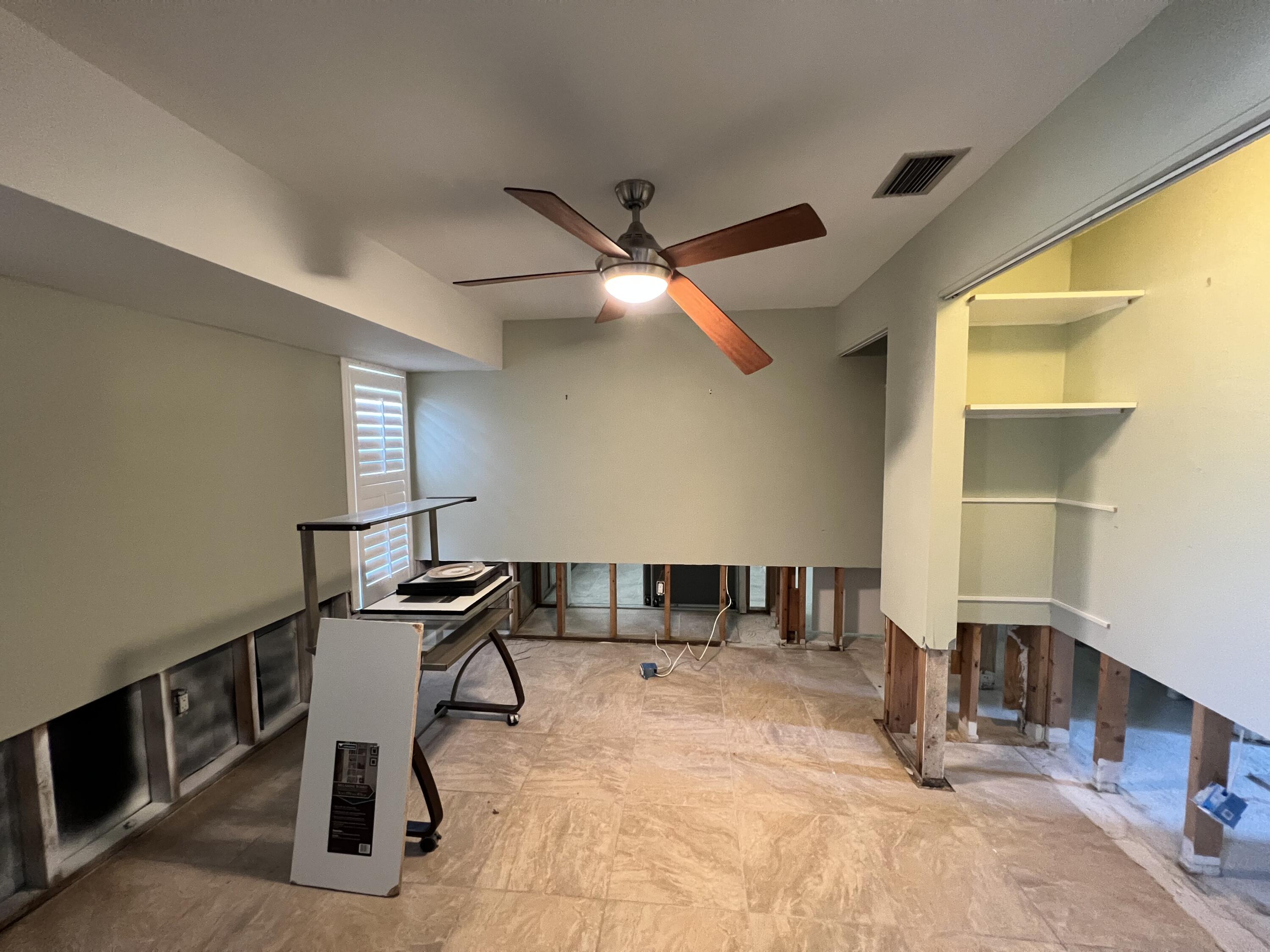 2392 Clipper Way Naples, FL 34104 - Photo 18 of 29 a room with gym equipment and view of living room