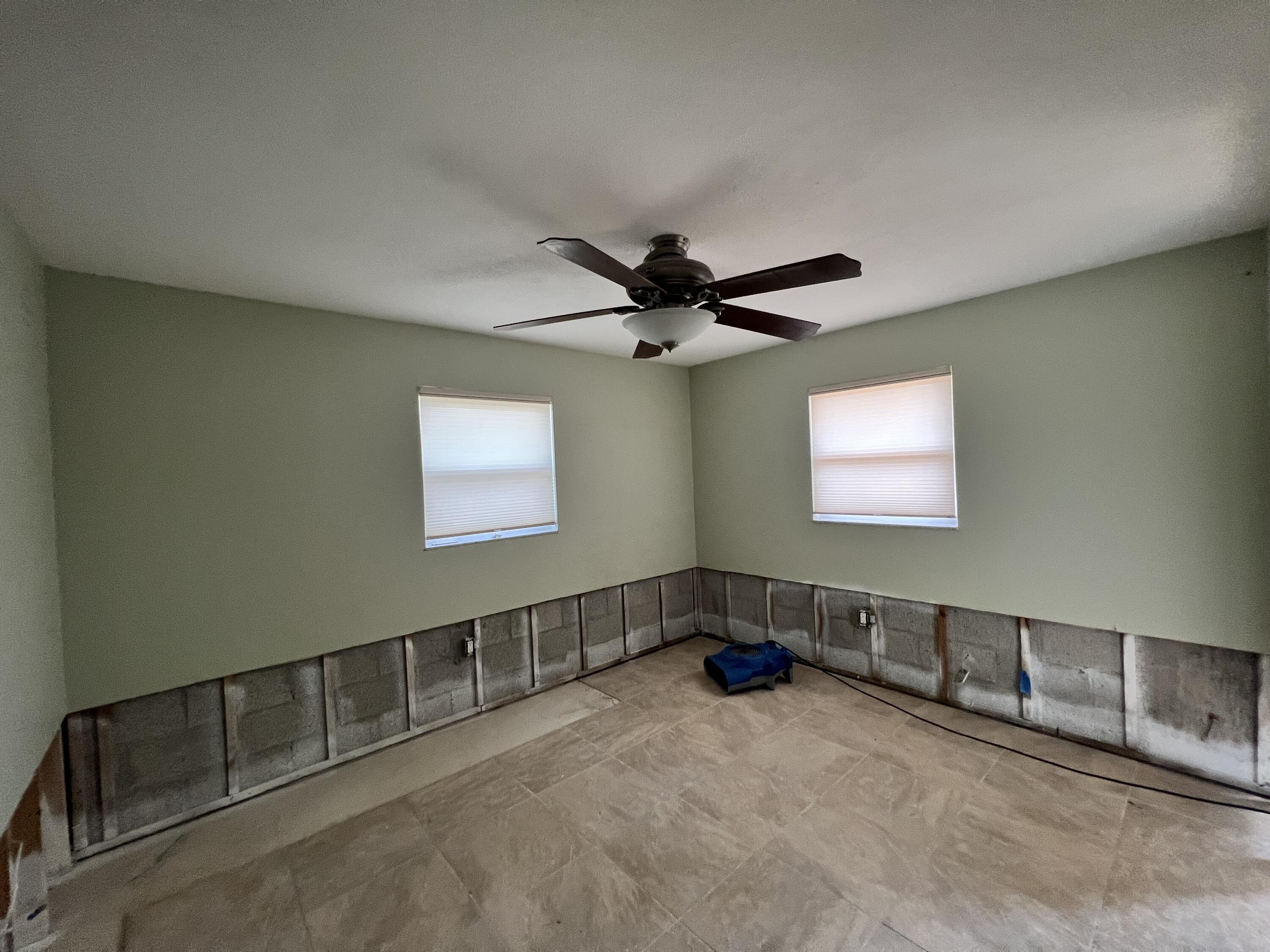 2392 Clipper Way Naples, FL 34104 - Photo 22 of 29 an empty room with windows