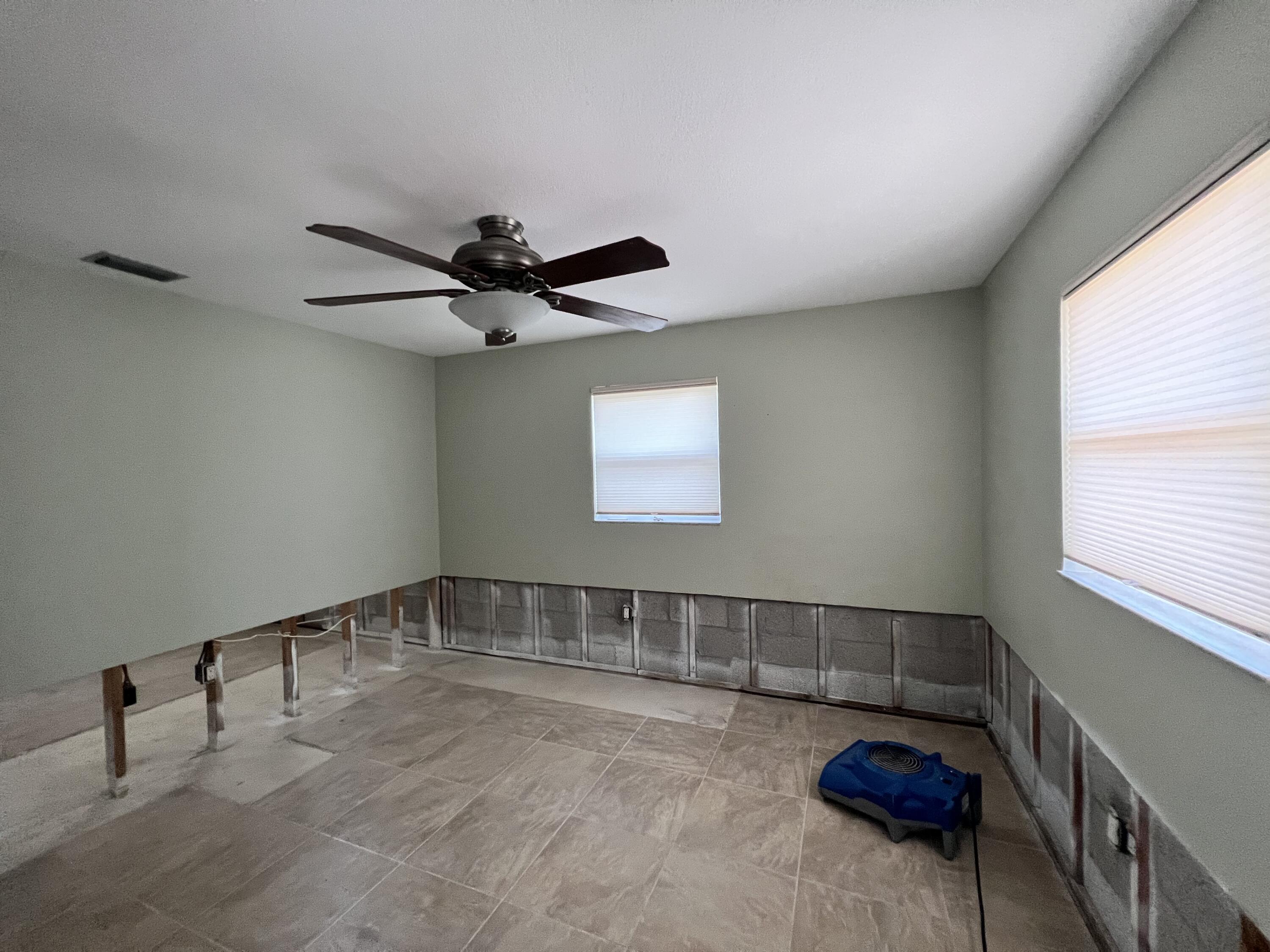 2392 Clipper Way Naples, FL 34104 - Photo 25 of 29 a view of a livingroom with a ceiling fan and window