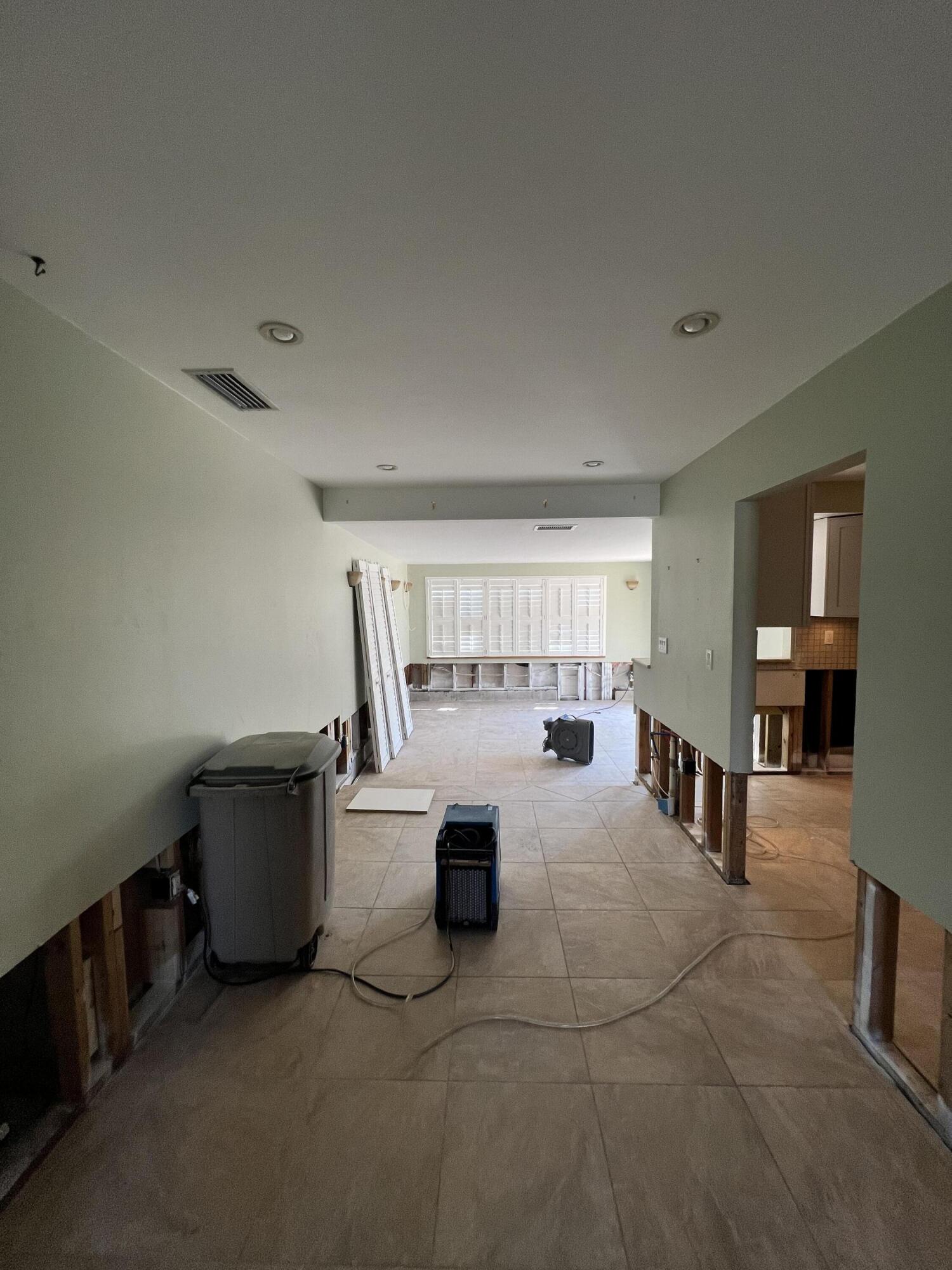 2392 Clipper Way Naples, FL 34104 - Photo 27 of 29 a living room with furniture and a wooden floor
