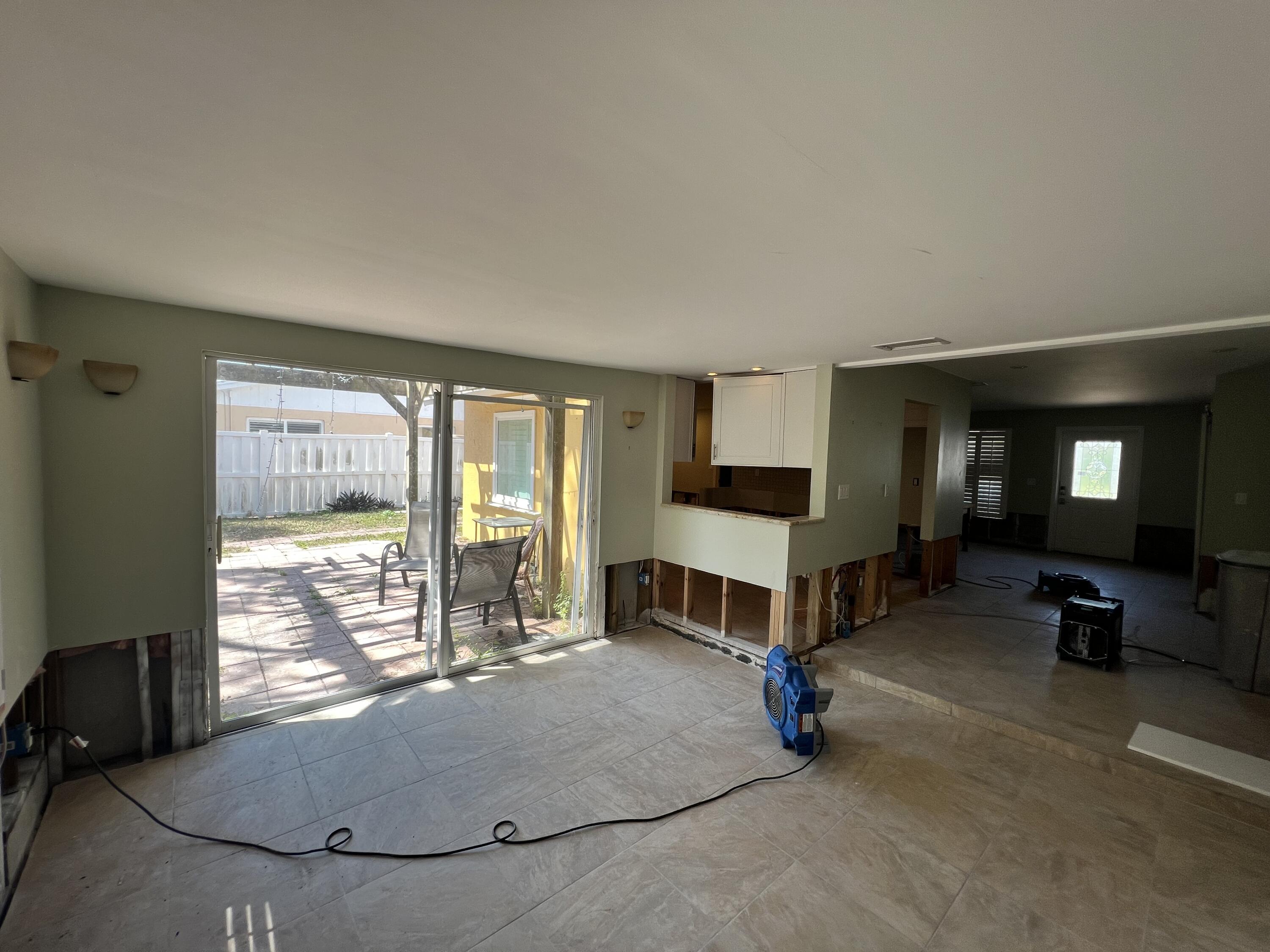 2392 Clipper Way Naples, FL 34104 - Photo 28 of 29 a living room with furniture and a flat screen tv