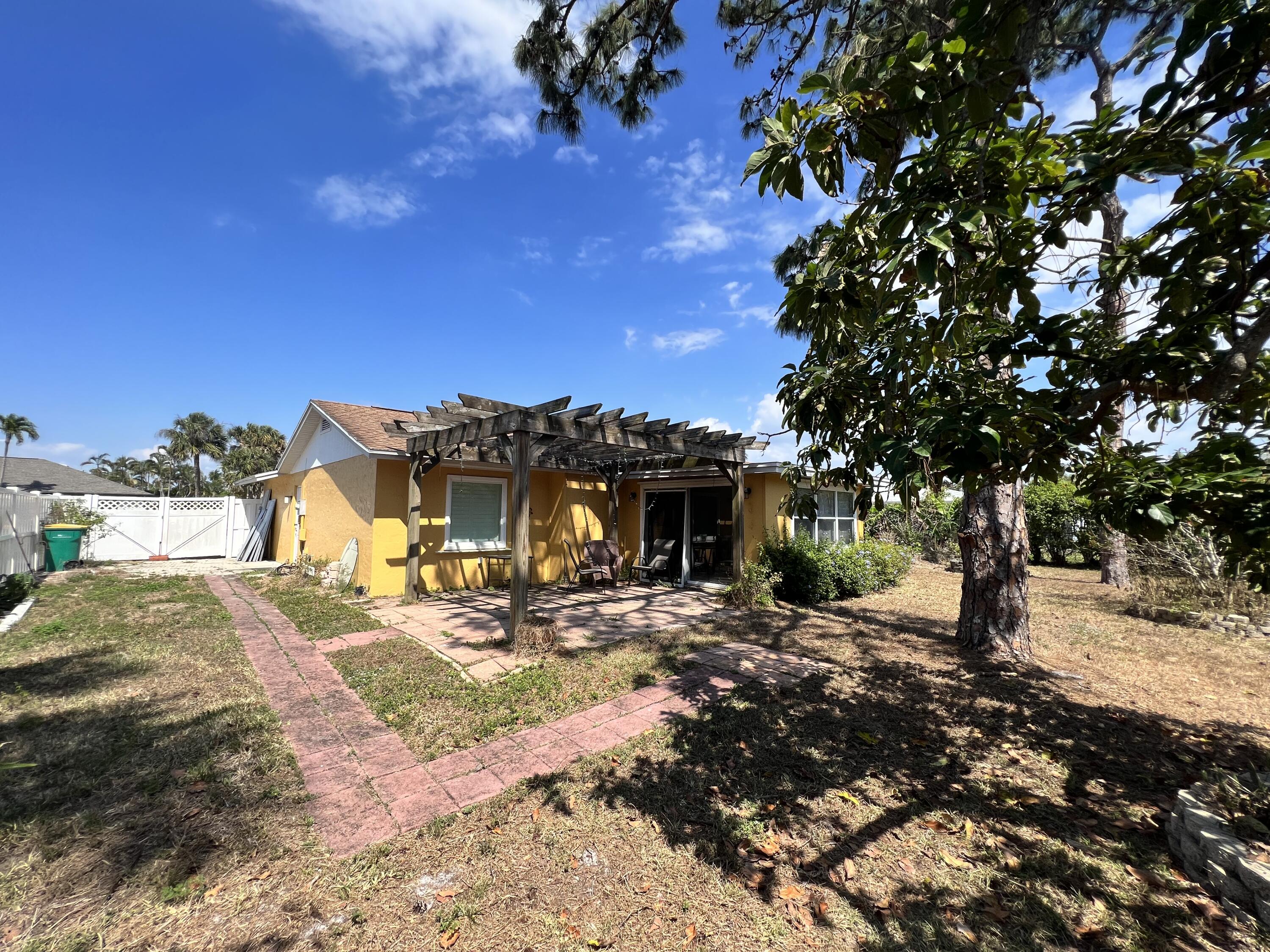 2392 Clipper Way Naples, FL 34104 - Photo 7 of 29 a view of a house with a patio
