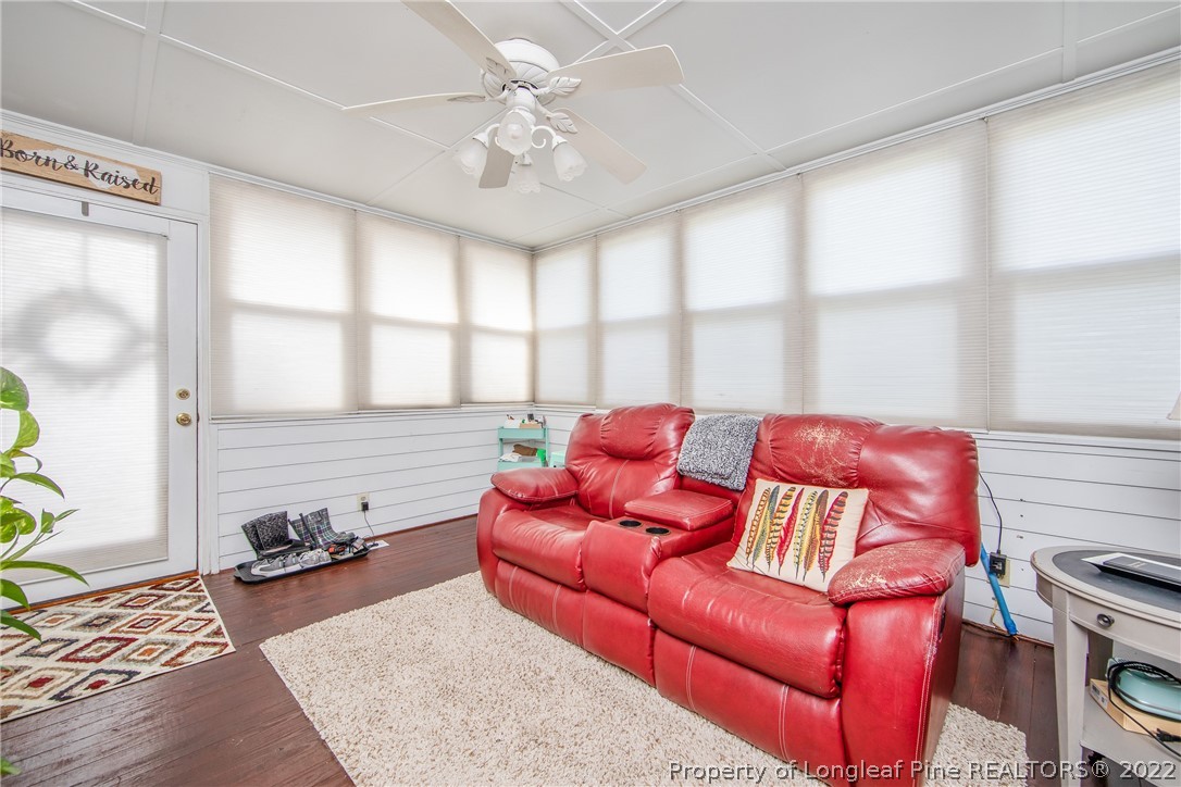 906 McKimmon Road Fayetteville, NC 28303 - Photo 16 of 33 a living room with furniture fireplace and a large window