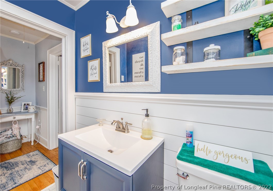 906 McKimmon Road Fayetteville, NC 28303 - Photo 21 of 33 a bathroom with a sink and a mirror