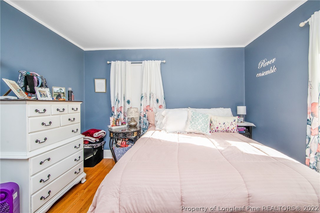906 McKimmon Road Fayetteville, NC 28303 - Photo 24 of 33 a bedroom with a bed and a closet