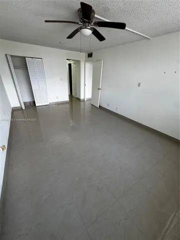 a view of a big room with carpet