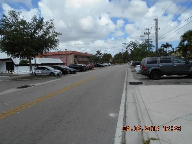 a view of street with parked cars