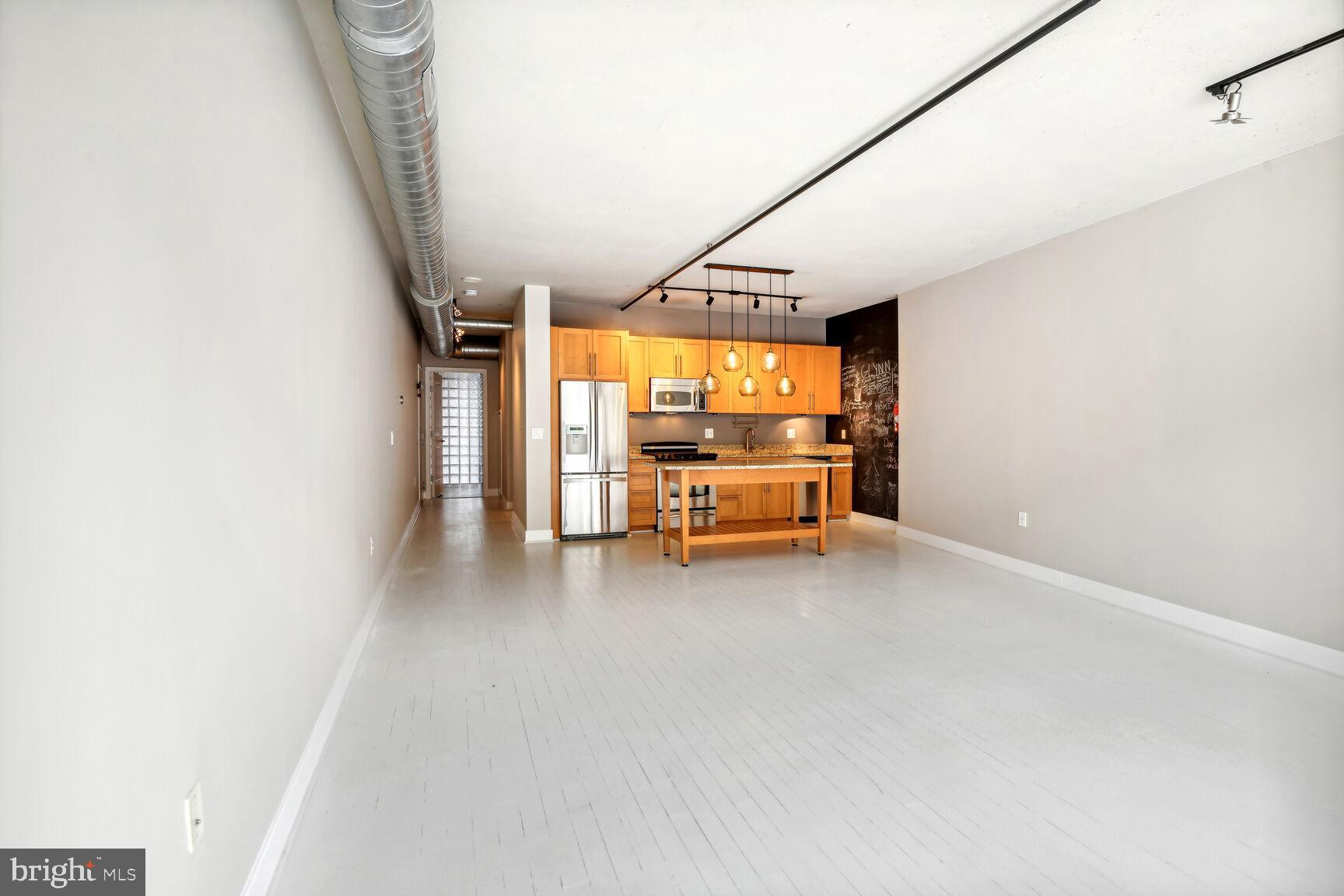 2125 14th Street Northwest, Unit 319 Washington, DC 20009 - Photo 11 of 23 a view of room with furniture and windows
