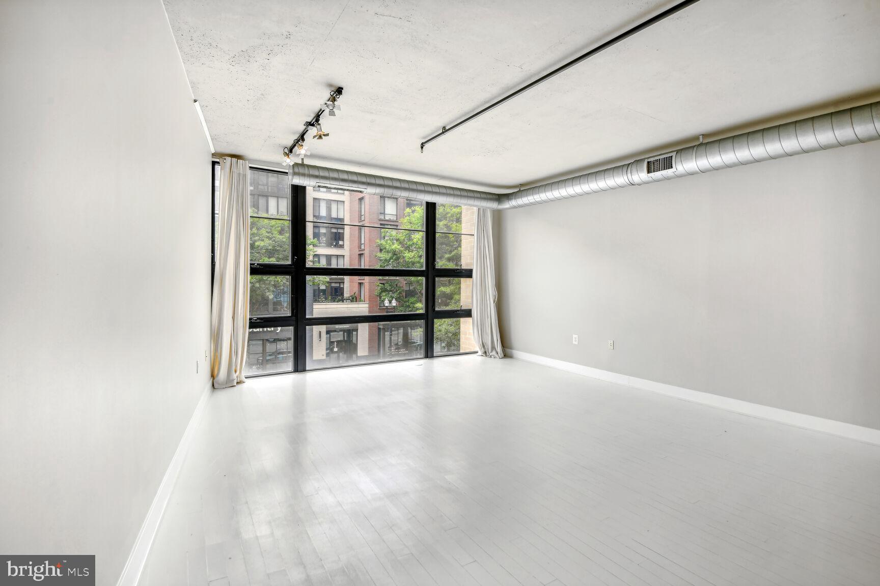 2125 14th Street Northwest, Unit 319 Washington, DC 20009 - Photo 12 of 23 a view of an empty room with a window
