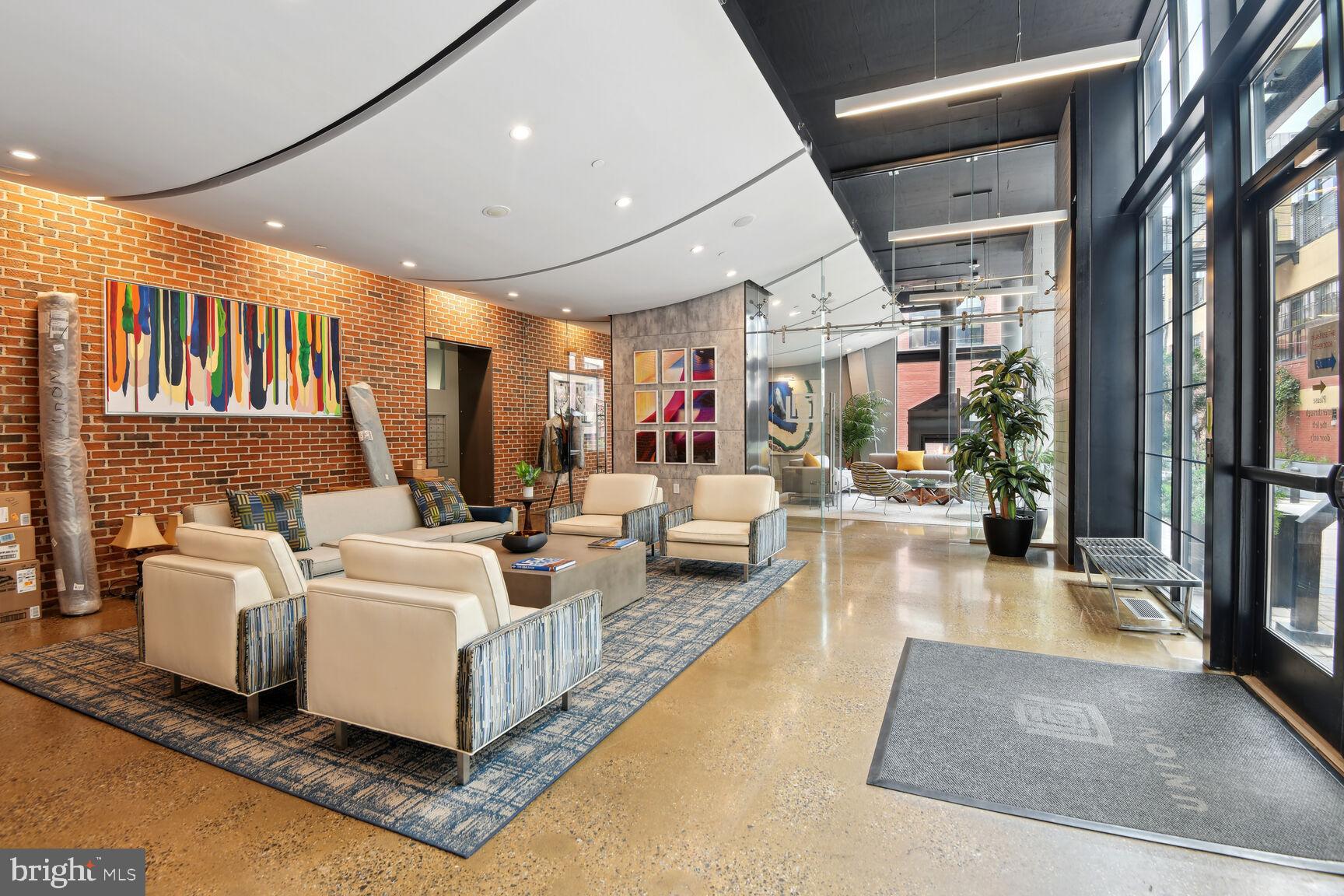 2125 14th Street Northwest, Unit 319 Washington, DC 20009 - Photo 20 of 23 a living room with fireplace furniture and a large window