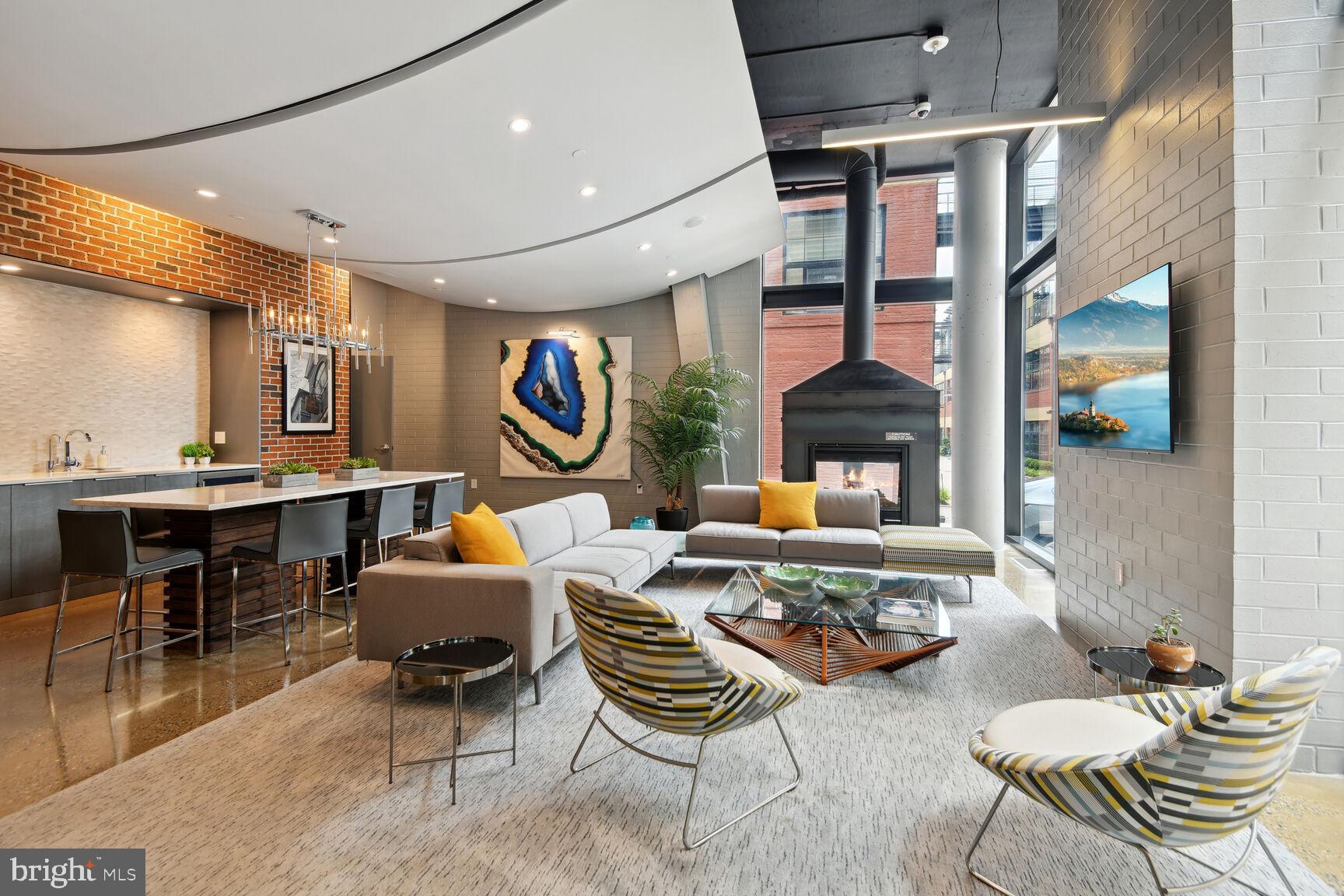 2125 14th Street Northwest, Unit 319 Washington, DC 20009 - Photo 21 of 23 a living room with furniture and a fireplace