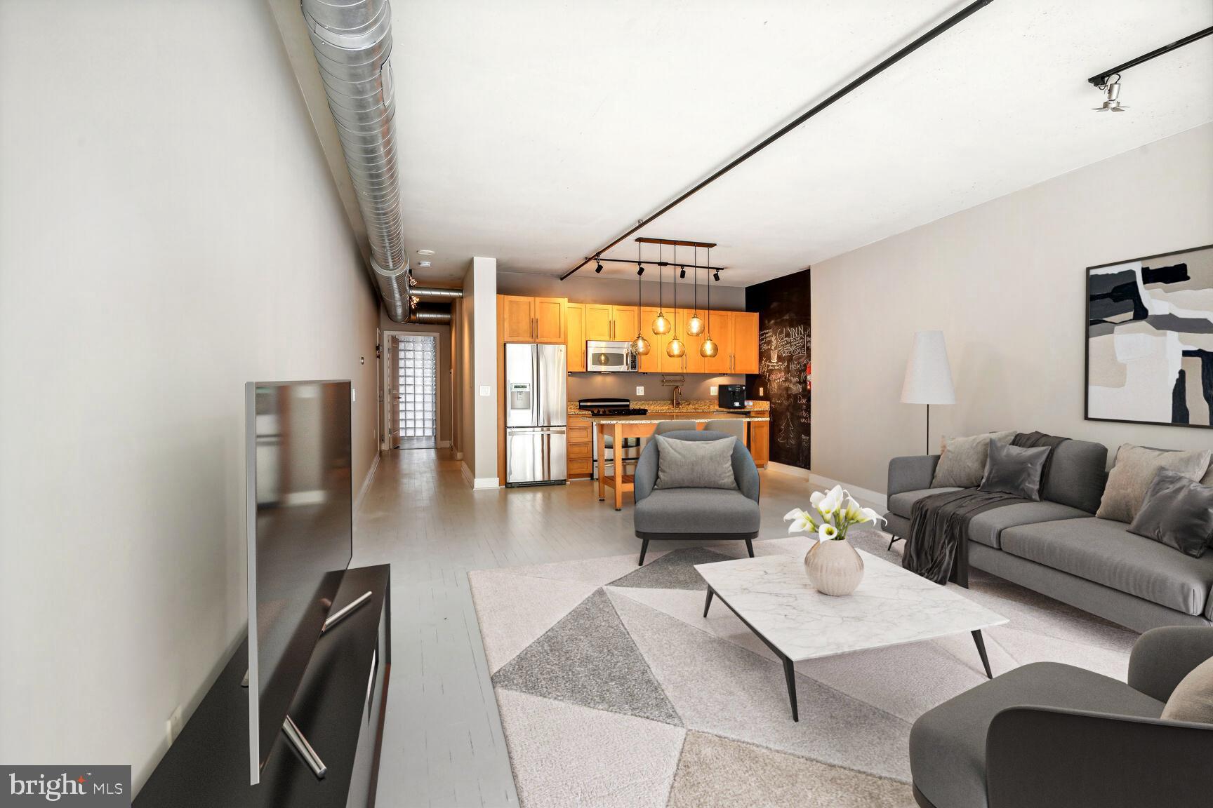 2125 14th Street Northwest, Unit 319 Washington, DC 20009 - Photo 7 of 23 a living room with furniture and a large window