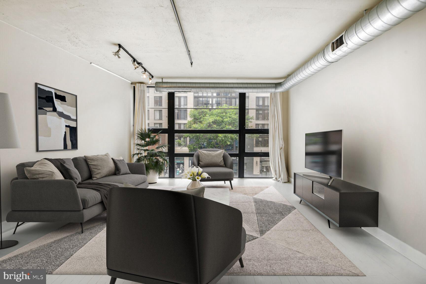 2125 14th Street Northwest, Unit 319 Washington, DC 20009 - Photo 8 of 23 a living room with furniture tv and a floor to ceiling window