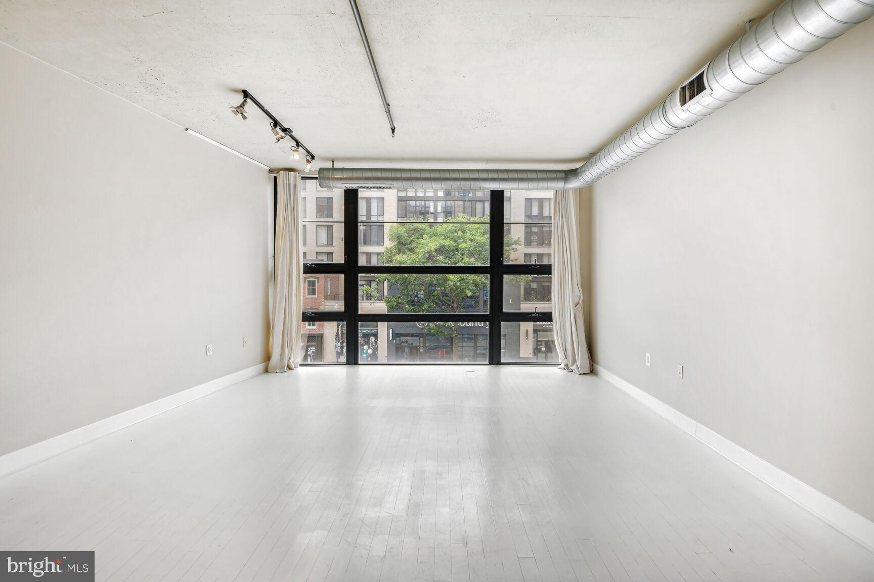 2125 14th Street Northwest, Unit 319 Washington, DC 20009 - Photo 10 of 23 a view of an empty room with a window