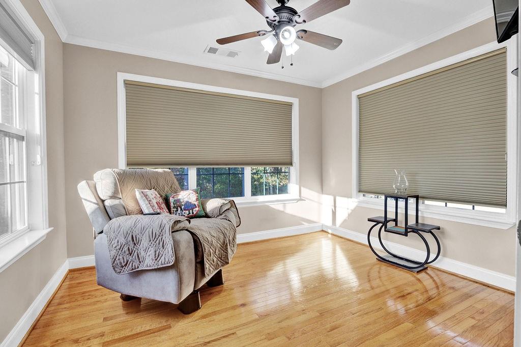 5636 River Stone Road Gainesville, GA 30506 - Photo 14 of 36 a living room with large couches and dining table with wooden floor