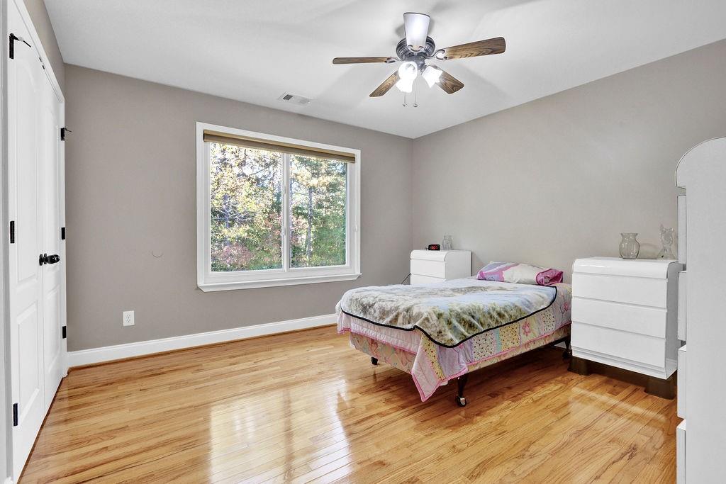 5636 River Stone Road Gainesville, GA 30506 - Photo 15 of 36 a spacious bedroom with a bed and a window