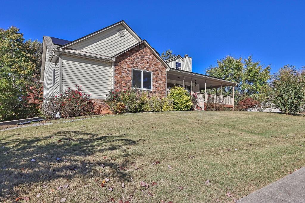 5636 River Stone Road Gainesville, GA 30506 - Photo 2 of 36 a front view of a house with garden