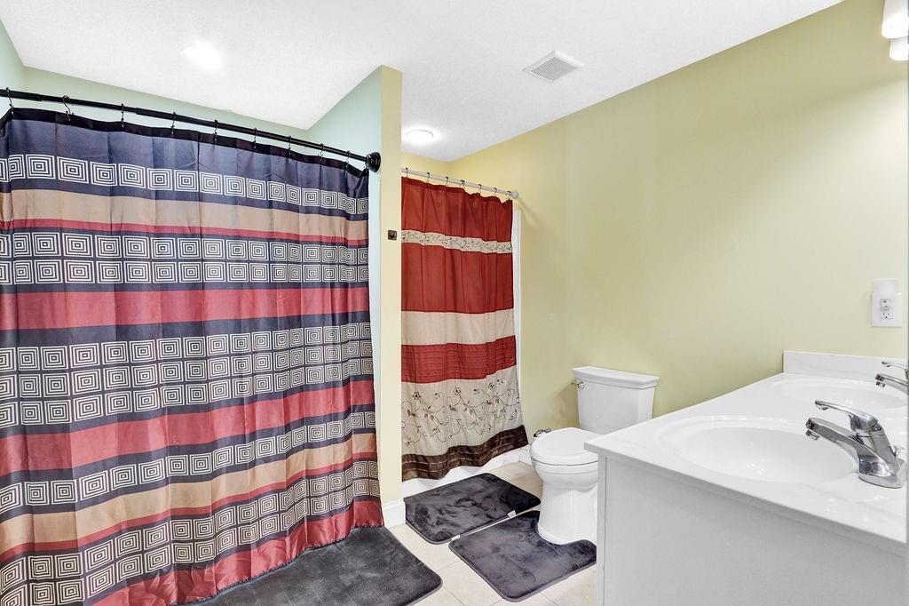 5636 River Stone Road Gainesville, GA 30506 - Photo 21 of 36 a bathroom with a sink toilet and shower