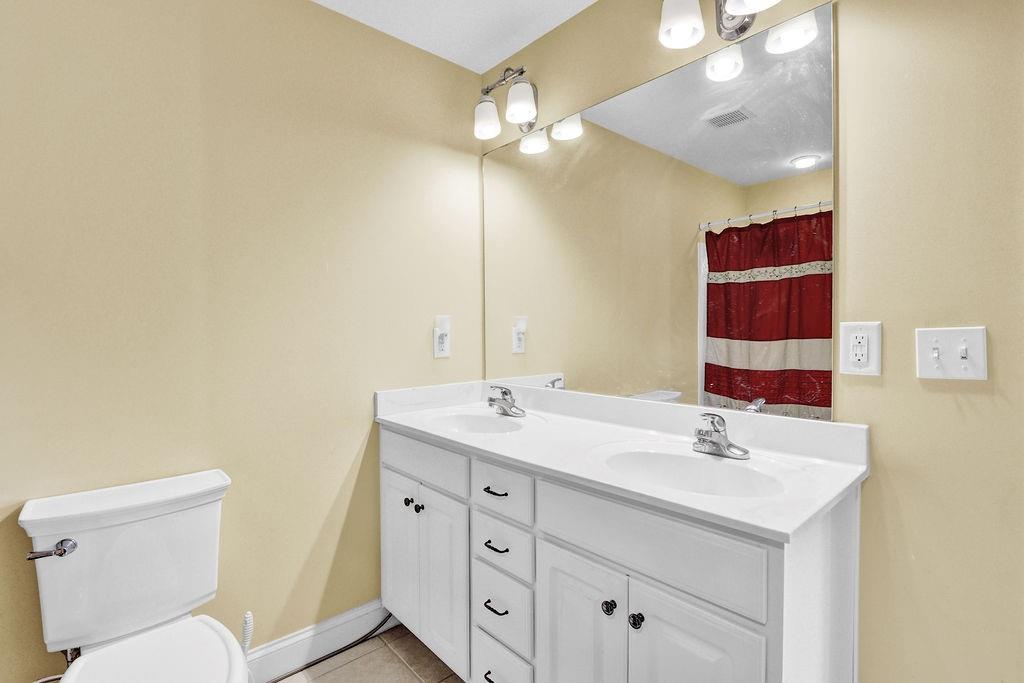 5636 River Stone Road Gainesville, GA 30506 - Photo 22 of 36 a bathroom with a sink and a mirror
