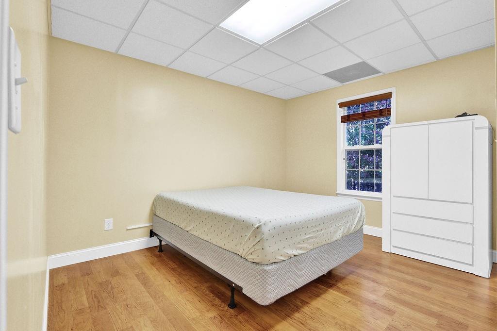 5636 River Stone Road Gainesville, GA 30506 - Photo 26 of 36 a bed room with a bed and a wall painting